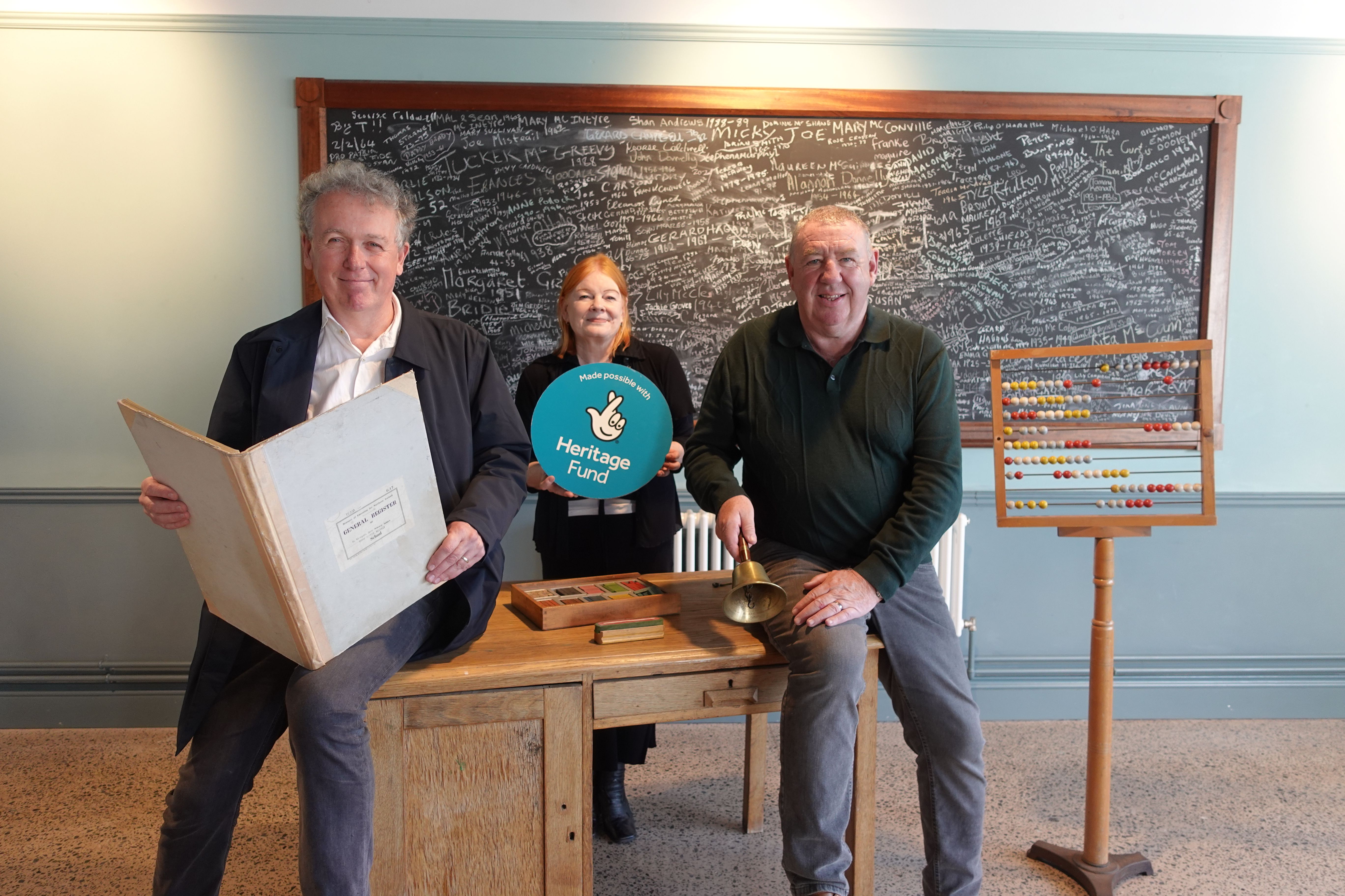 HERITAGE PROJECT: Dr Paul Mullan (Director of The National Lottery Heritage Fund) with Marie Maguire and Gerry McConville from Falls Community Council