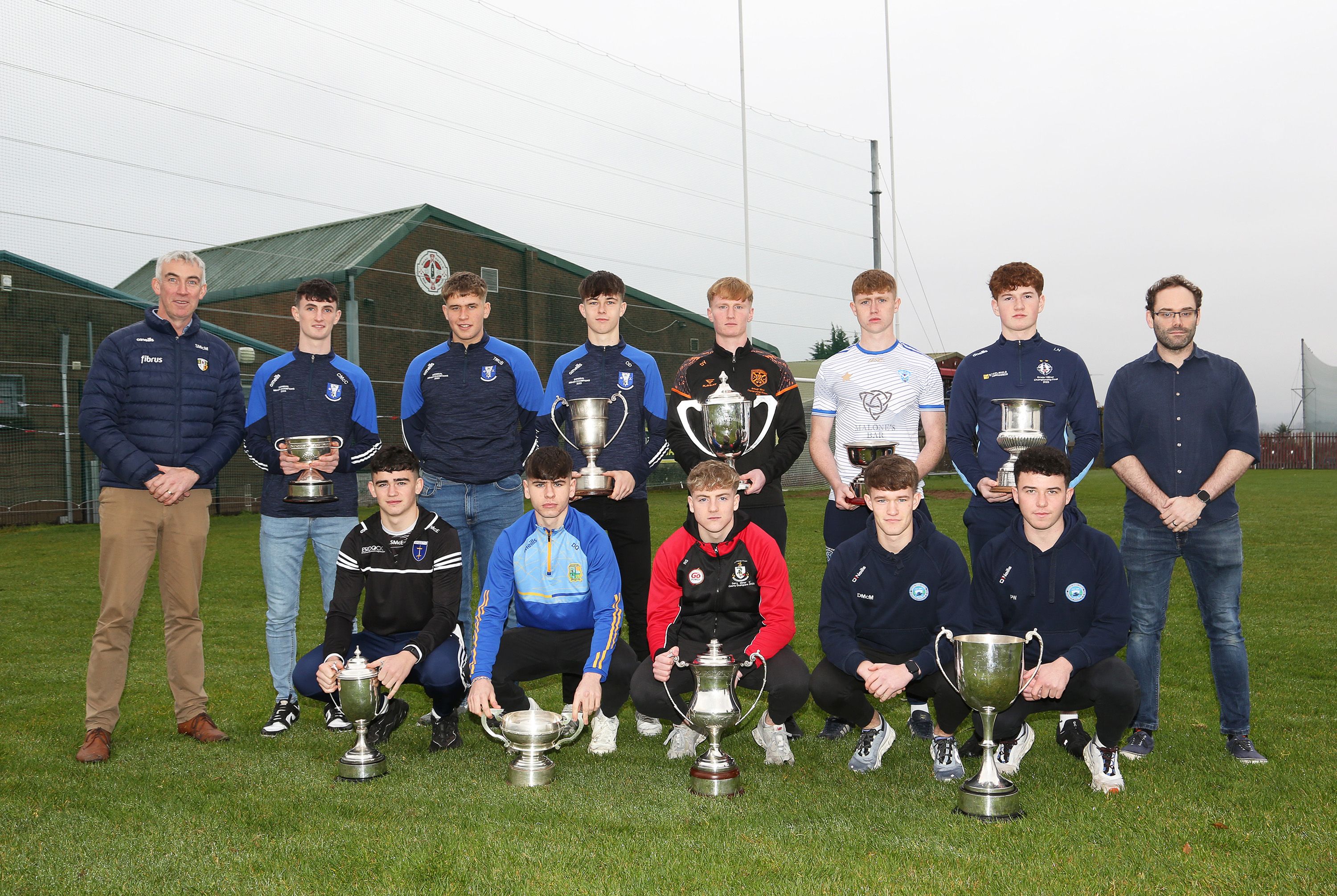 Captains from the clubs involved with Antrim chairperson, Seamus McMullan and Sean Walshe from sponsors, fonaCAB