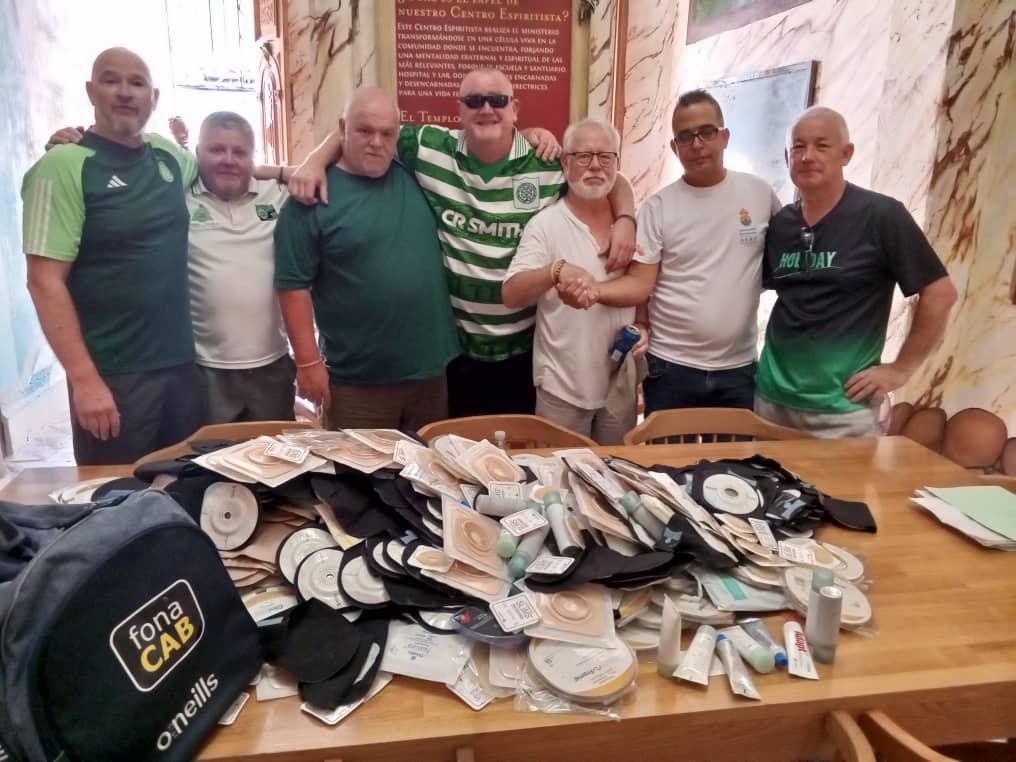 SHOT-IN-THE-ARM: Gerard McCarry hands over medical supplies to a Cuban hospital official