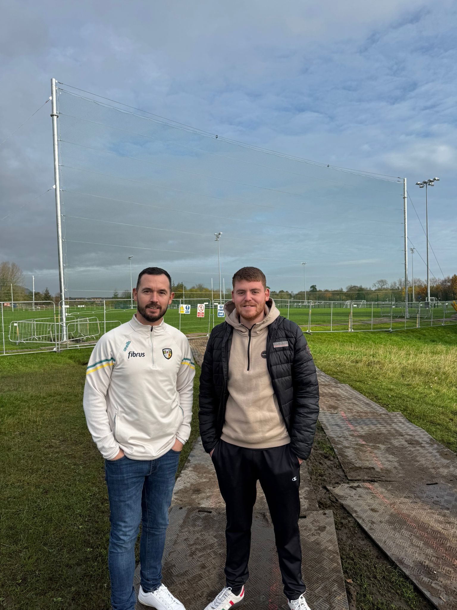 PITCH: Cllr Micheal Donnelly and Cllr Ronan McLaughlin at the newly improved Falls Park GAA pitch