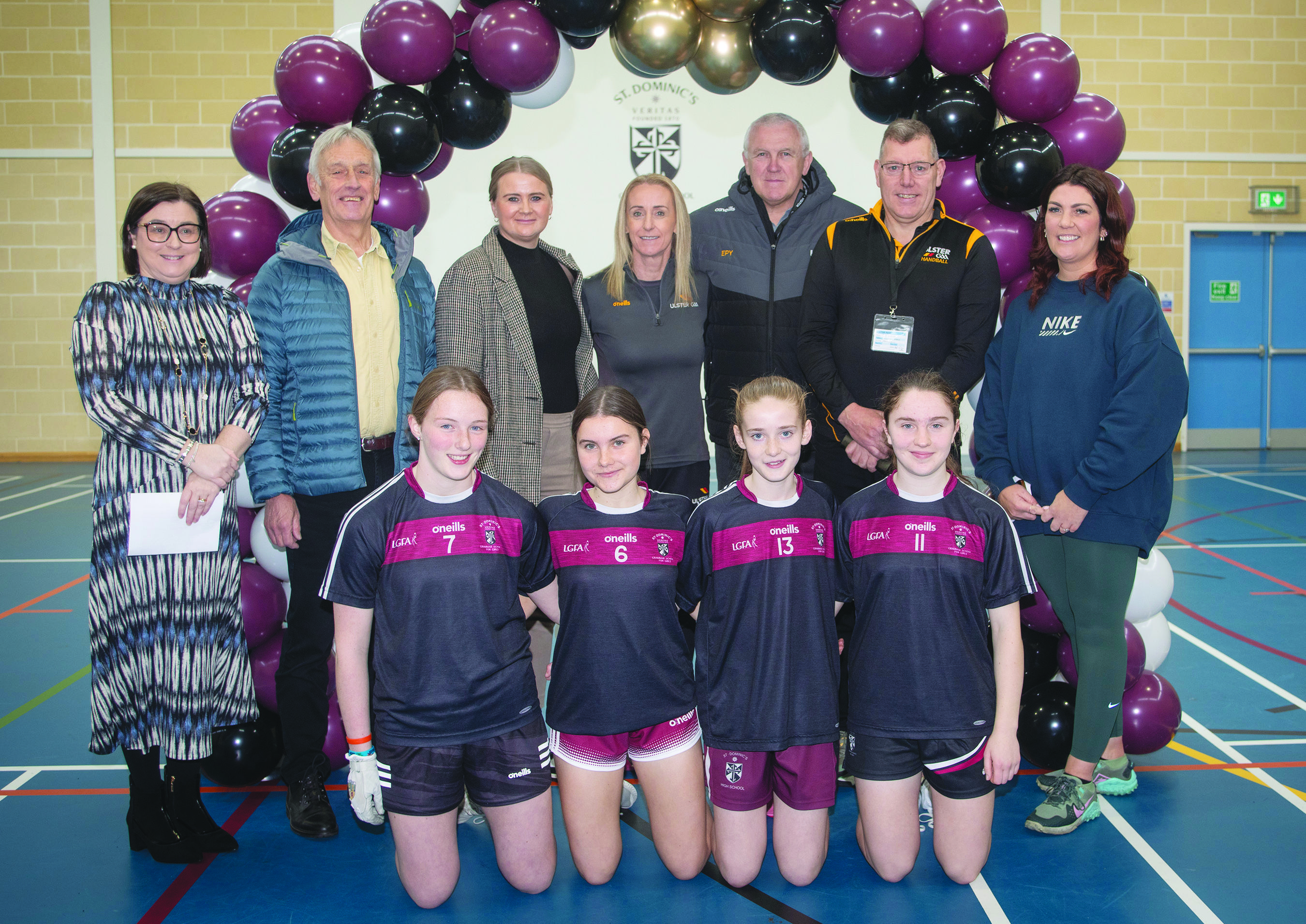 St Dominic’s pupils and staff including principal, Mrs Orla O’Neill (back left) and PE teacher Mrs Laura Bannon (back right) are joined by Board of Governers chair, Rory Galway, Aisling Reilly MLA, Fiona Shannon, Gerry O’Neill and Eugene Young on Tuesday