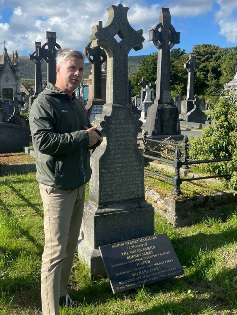 TOUR: Stevie Corr at the grave of the McMahon family who were murdered during the pogroms of 1922