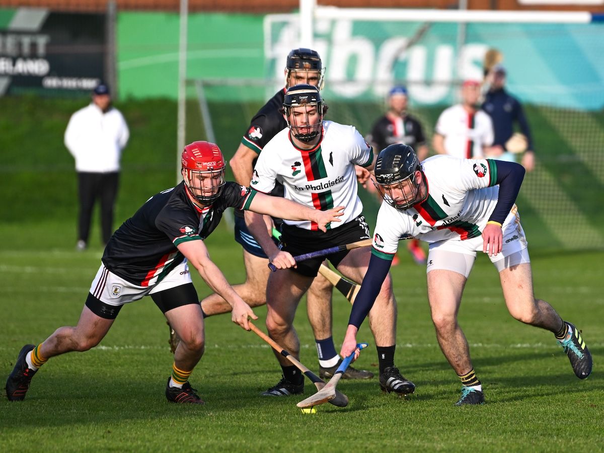 Caoimhin Marren from Galway and Antrim\'s Joe Maskey contest possession with Gerard Walsh looking on