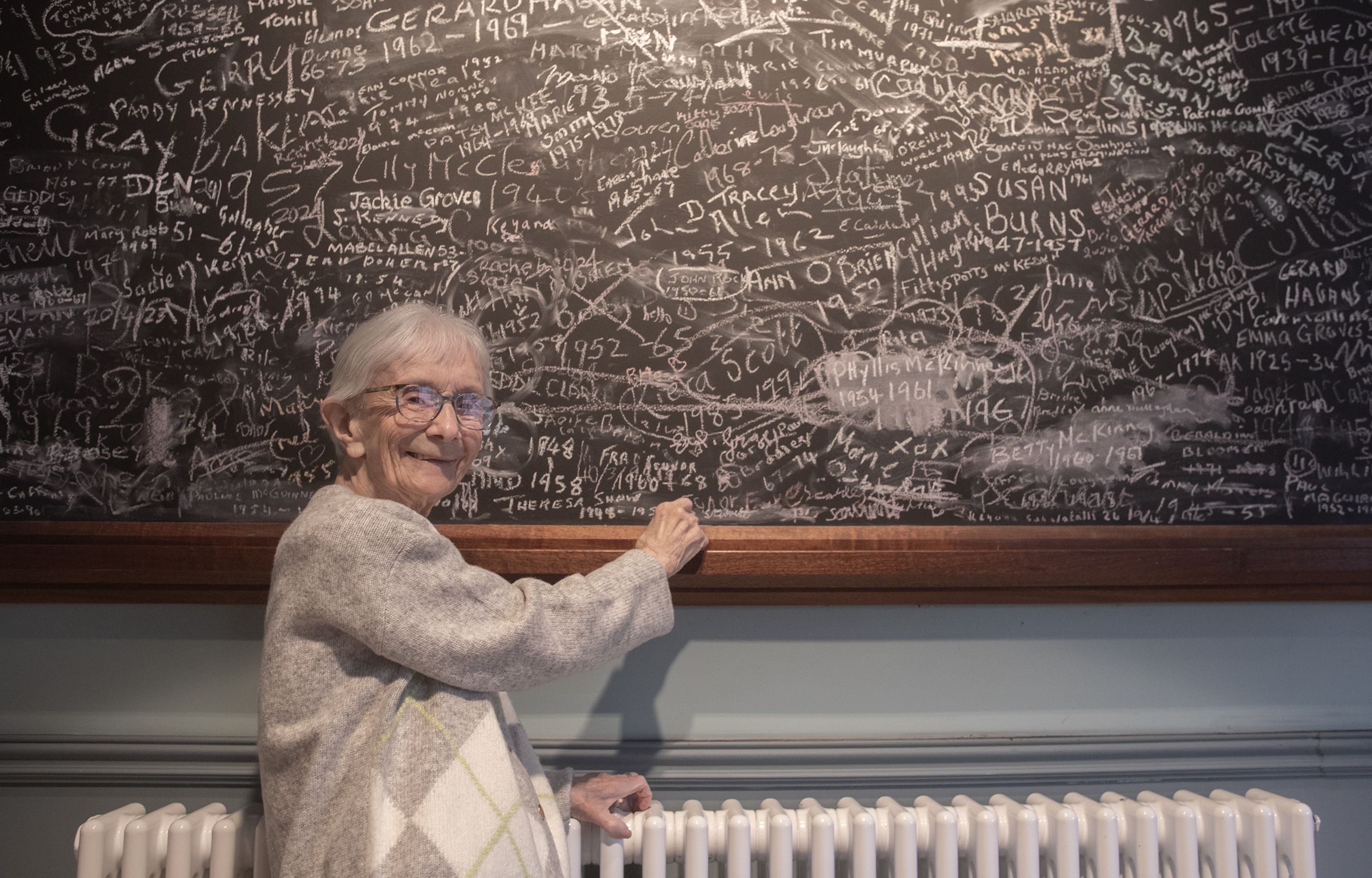 PAST PUPIL: May McGarrigle signs the blackboard in St Comgall\'s