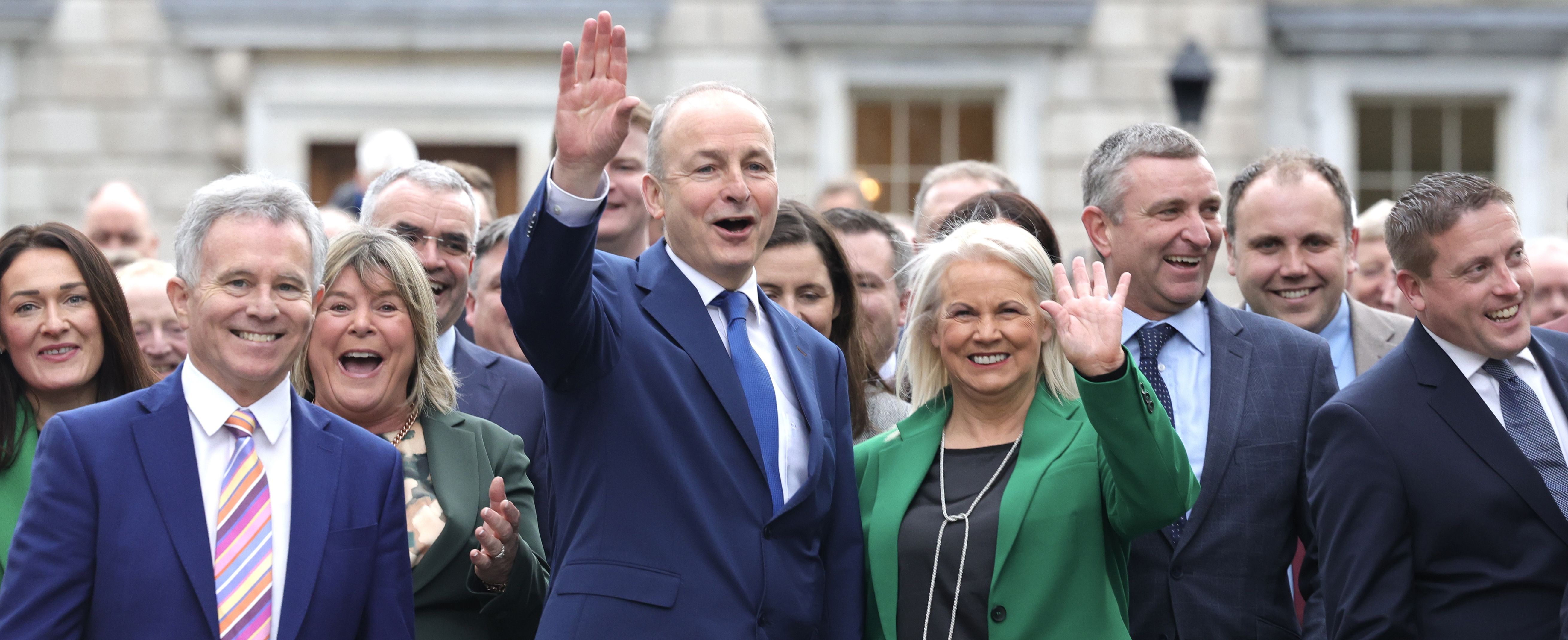 IN THE DRIVING SEAT: Fianna Fáil Leader Micheal Martin leads out his victorious group of TD\'s to the front of Leinster House 