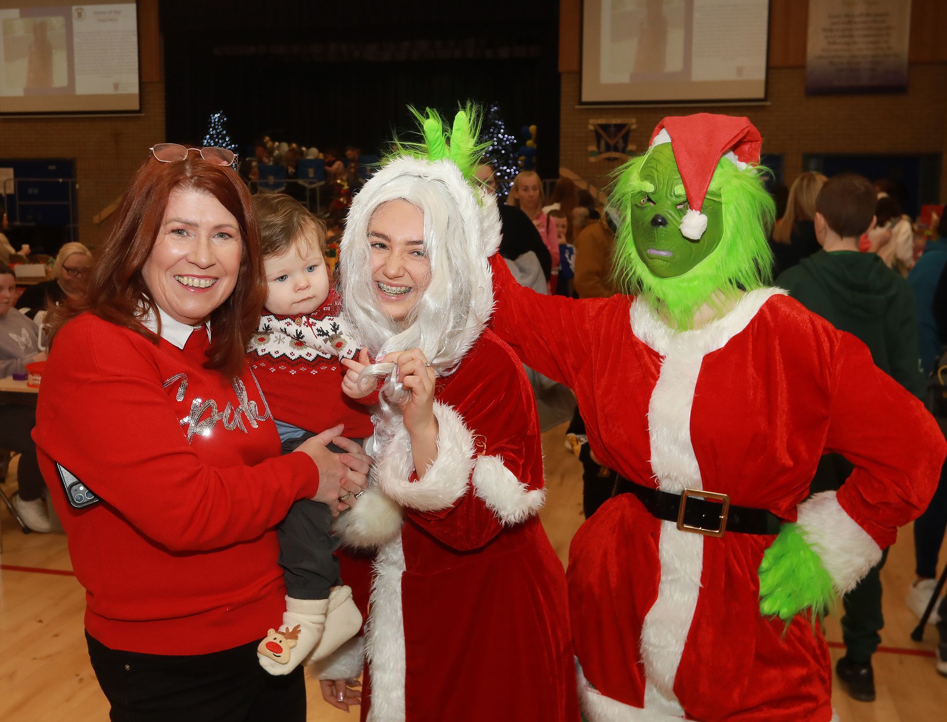 Cian Gribben with her granny and Acting Principal Cathy Austin, with Mrs Clause and the Grinch who were Head Girl’s Cassie and Chanel
