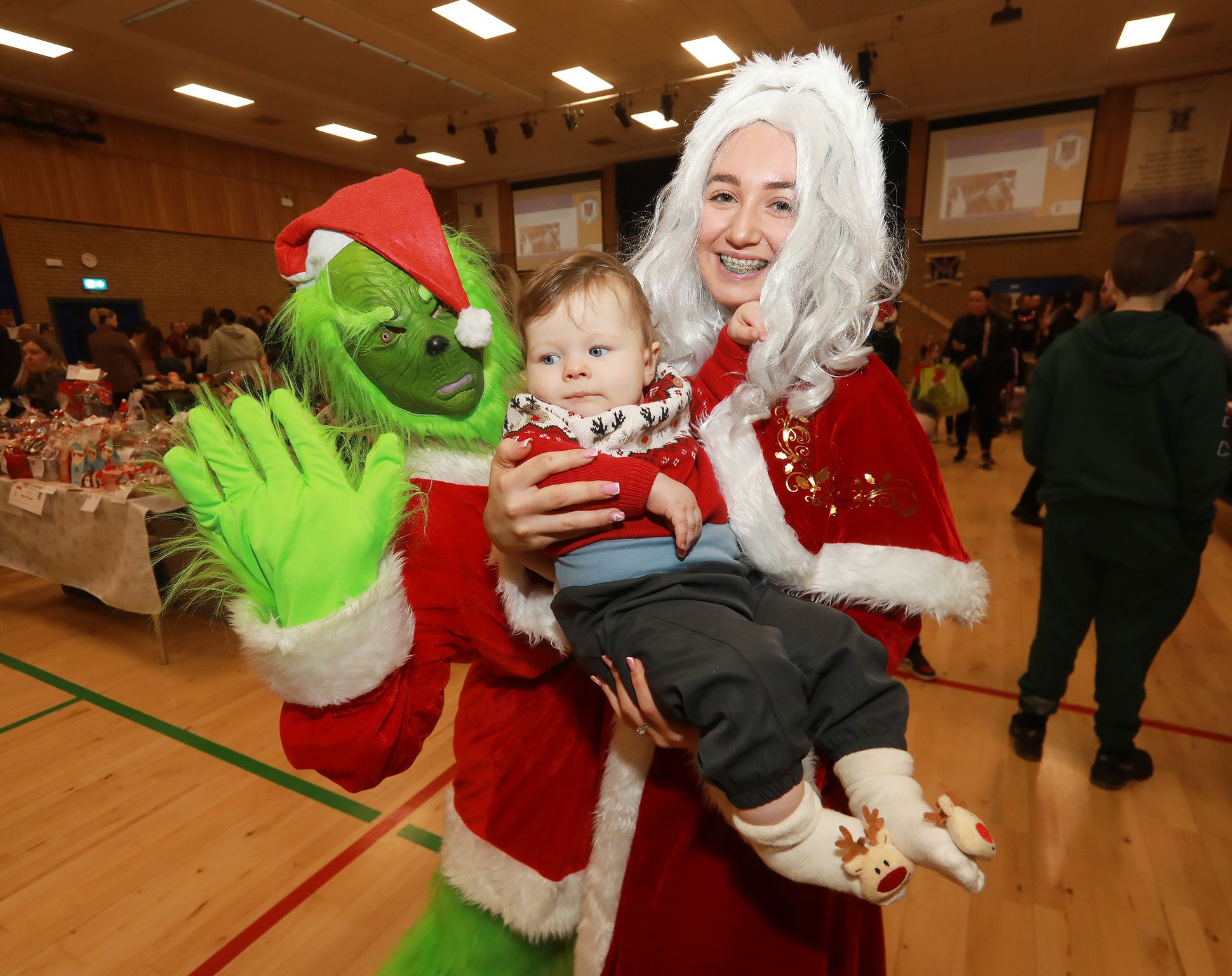 Cian Gribben with Mrs Clause and the Grinch, Head Girl’s Cassie and Chanel
