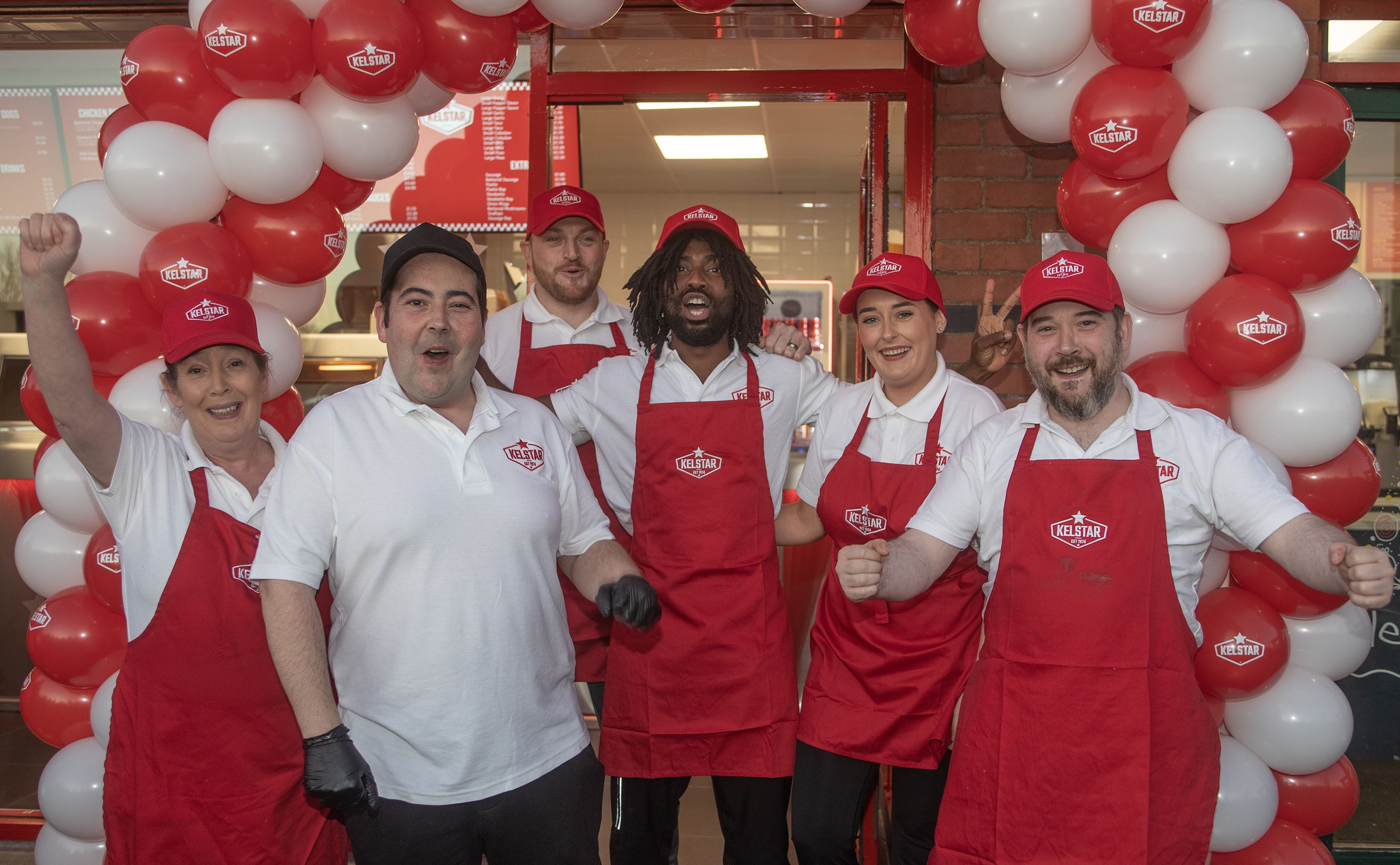 LAUNCH: Kelstar staff with Fabu-D, also known as \'Black Paddy\', at the new shop on the Blacks Road