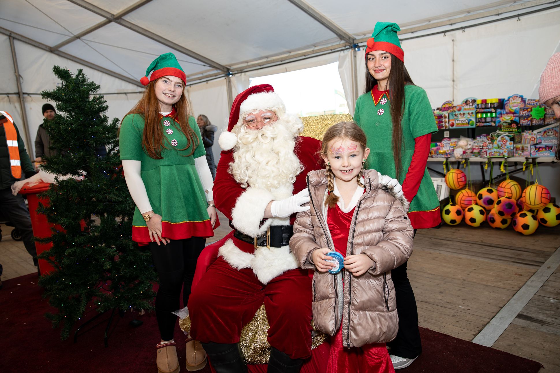 Charlotte Adams with Santa Claus and elves Liosa Stone and Cara Lynch