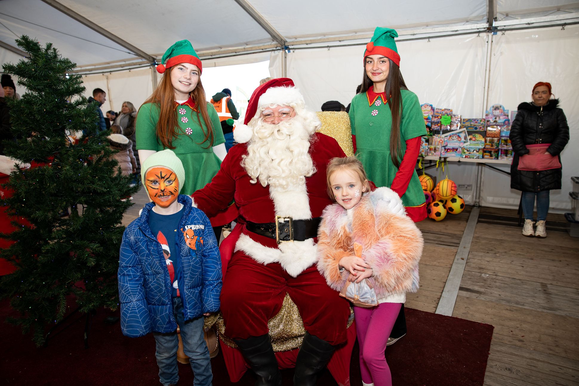 Richie Armstrong and Georgie Mae Scollay with Santa Claus and elves Liosa Stone and Cara Lynch