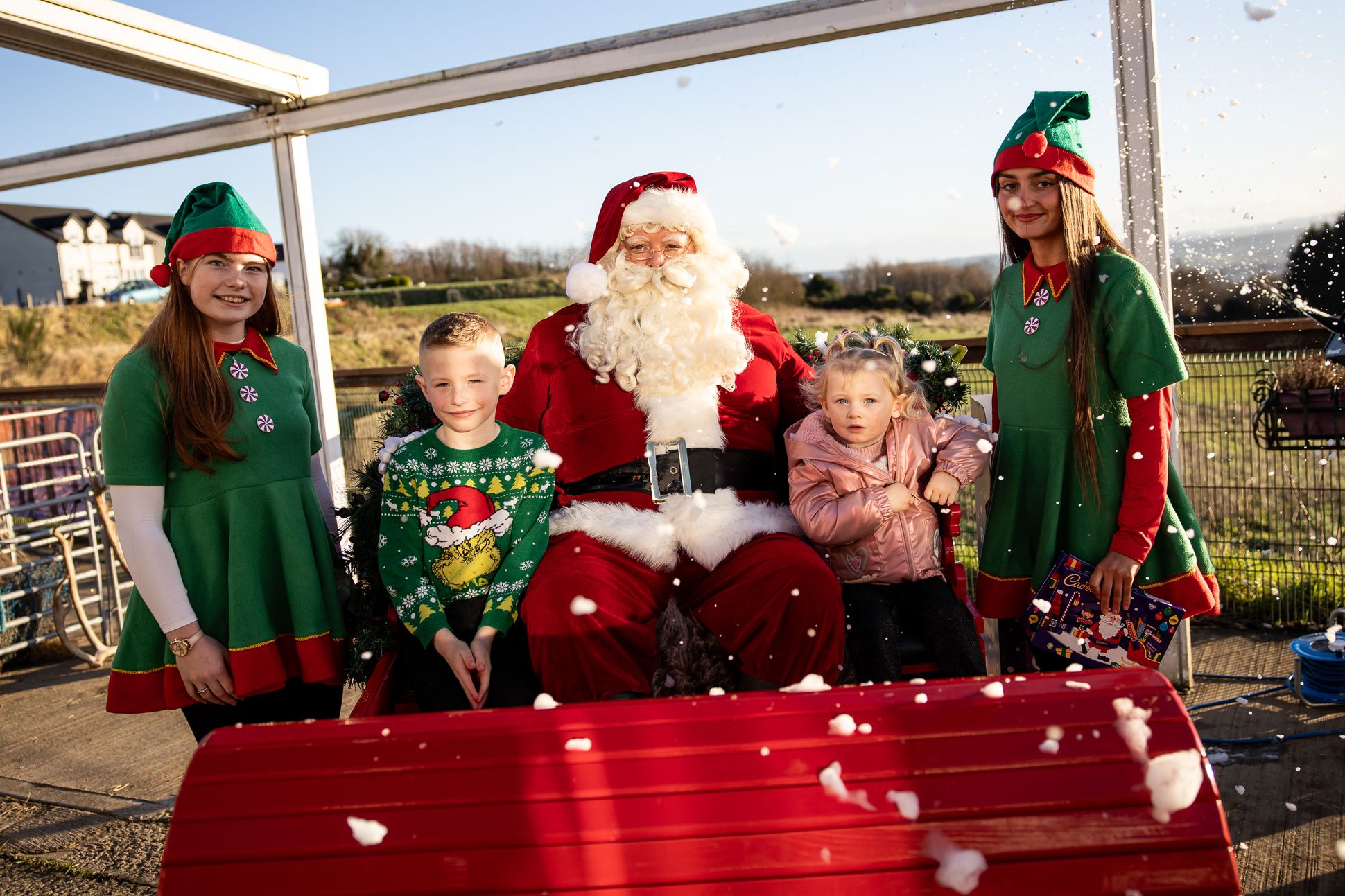 Carter and Katie Spiers with Santa Claus and elves Liosa Stone and Cara Lynch