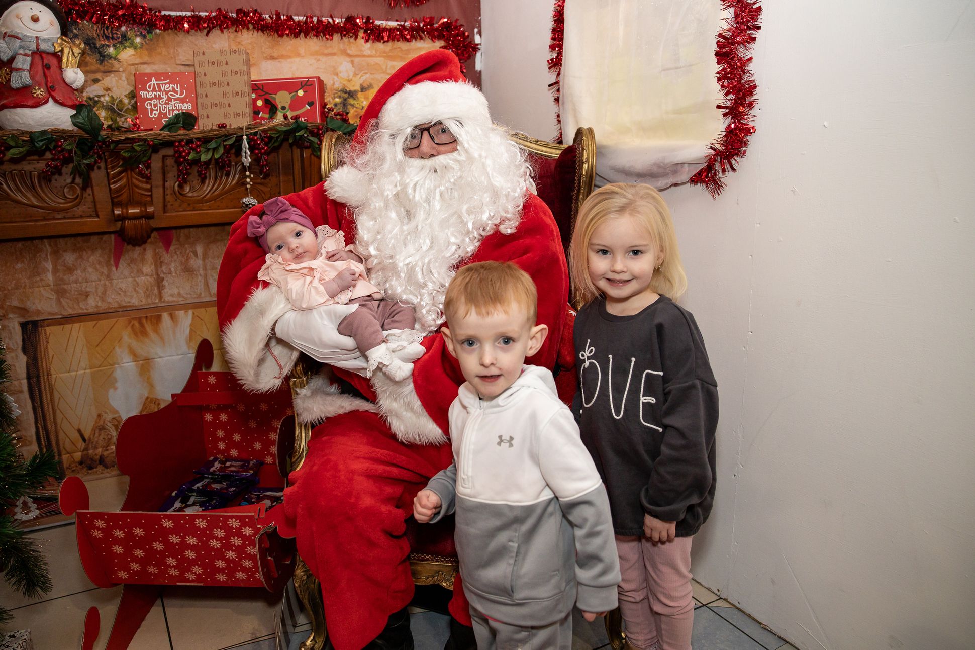 Sienna Lenaghan, Harley and Bella Heaney with Santa Claus