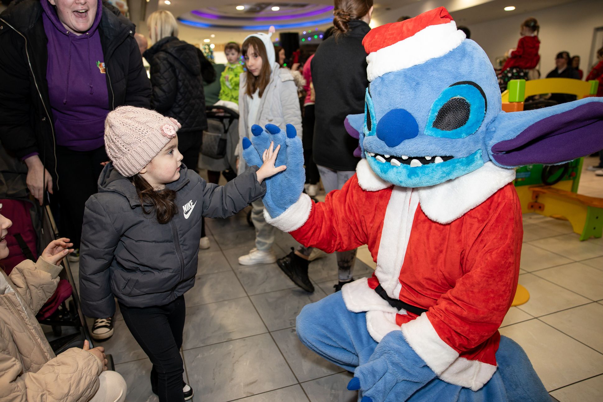 Stitch greets children at Santa's arrival at the Park Centre