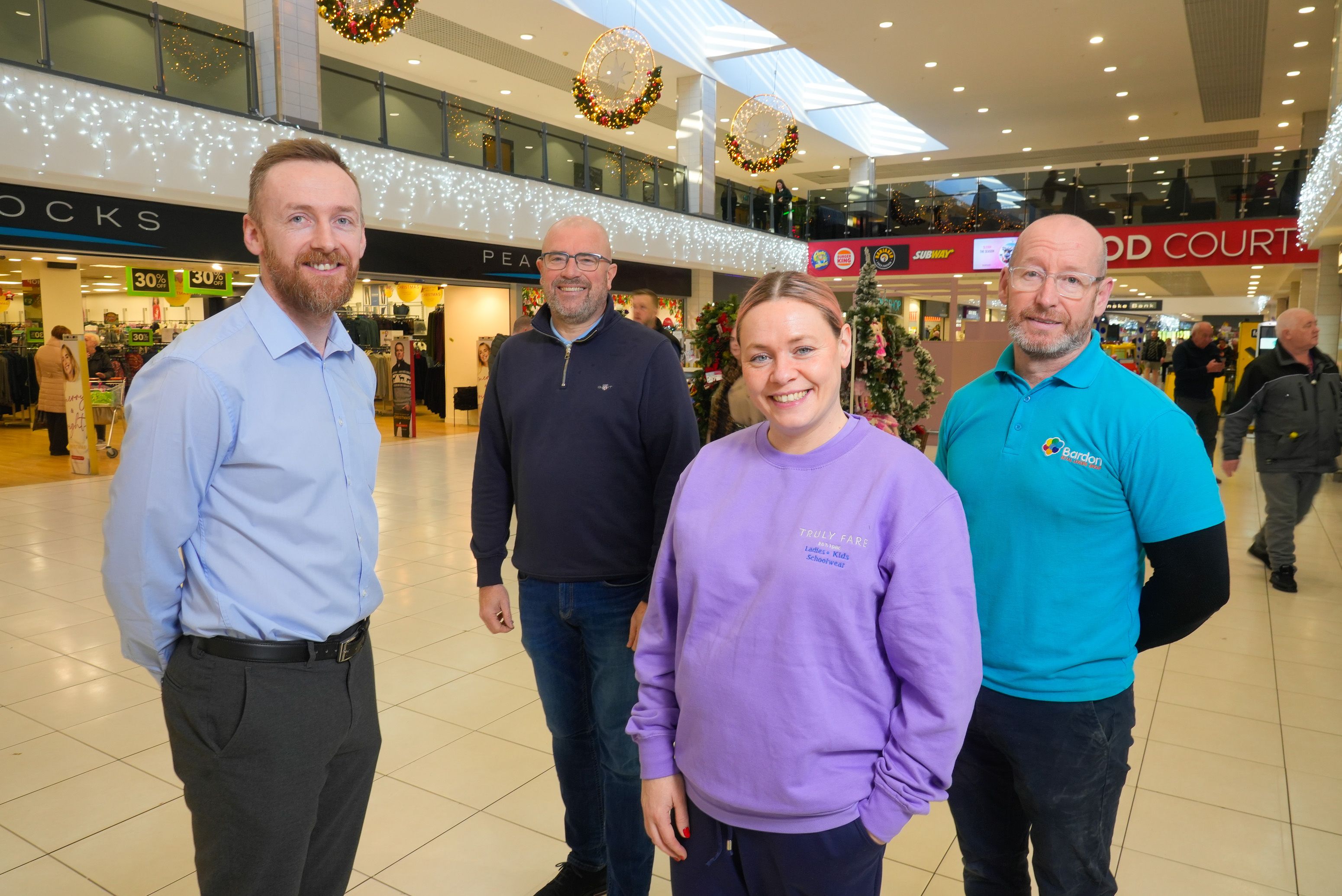 THRIVING: Joe Caddell (Store Manager, O\'Neill\'s), John Jones (Centre Manager of Kennedy Centre) , Francesca Cahill (Director, Truly Fare) and Eamon Campbell (Operations Manager, Bardon Leisure)