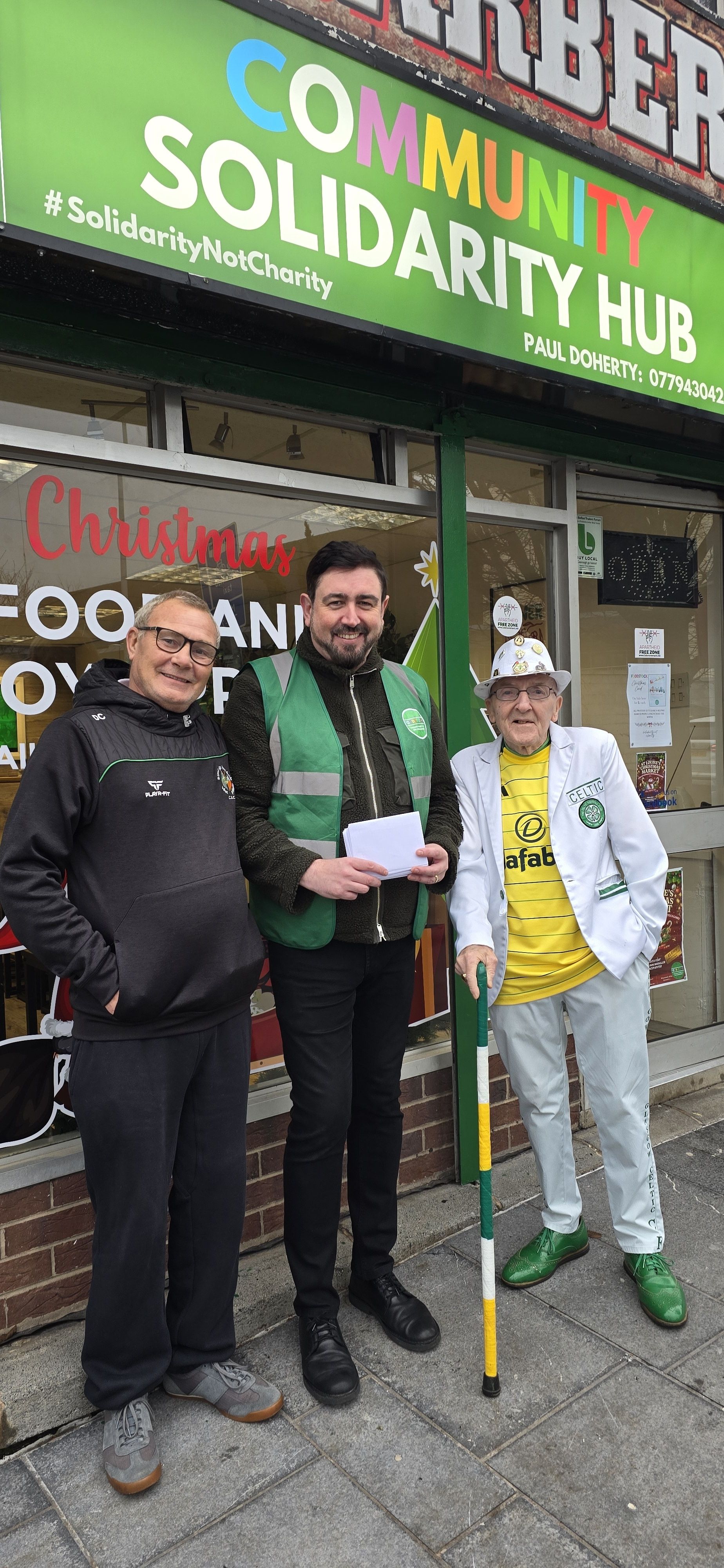 DONATION: Wee Duff and Danny Campbell from Éire Go Brách CSC make the presentation to Paul Doherty from Foodstock