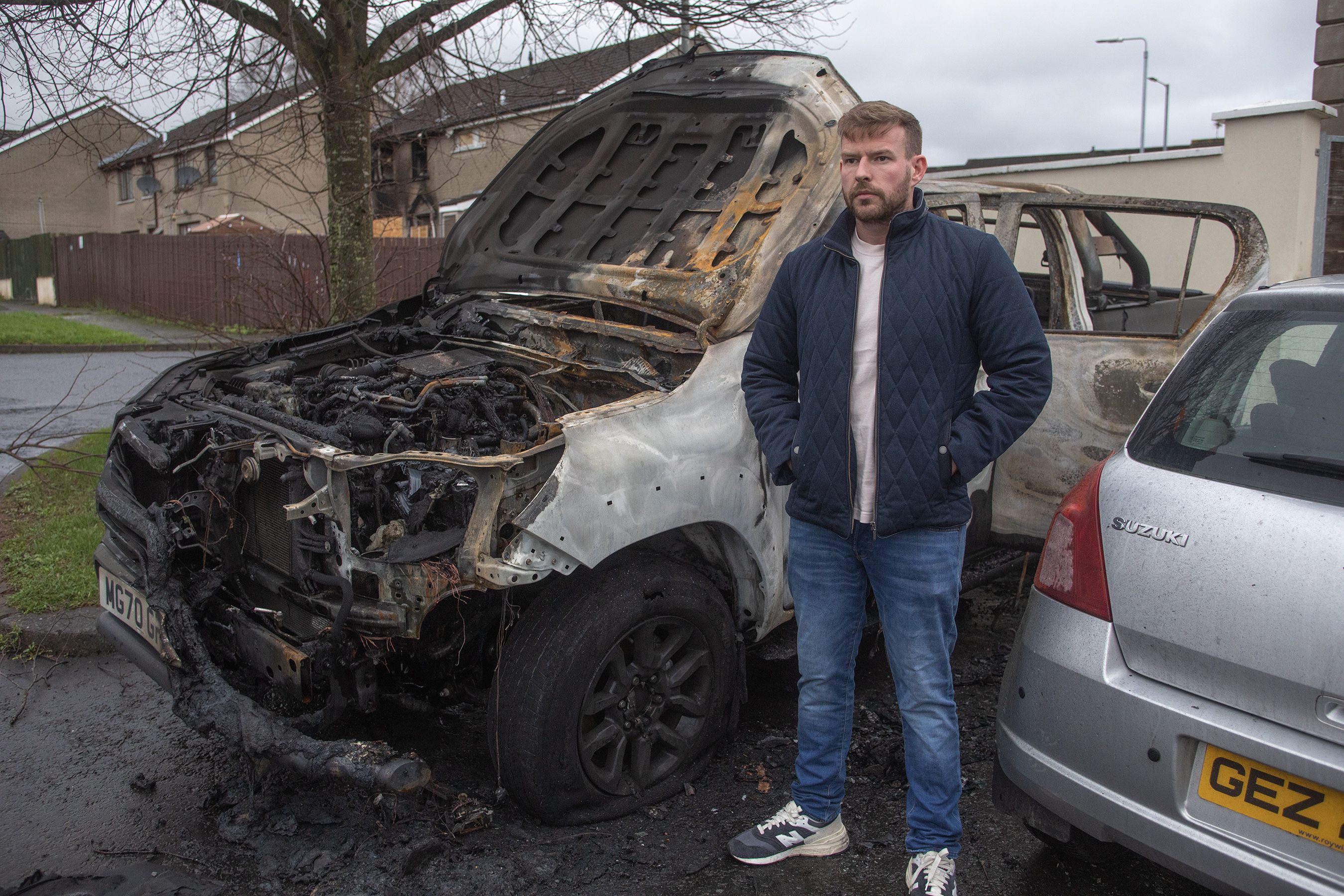 TARGETED: Nathan Kane at his jeep which was set alight