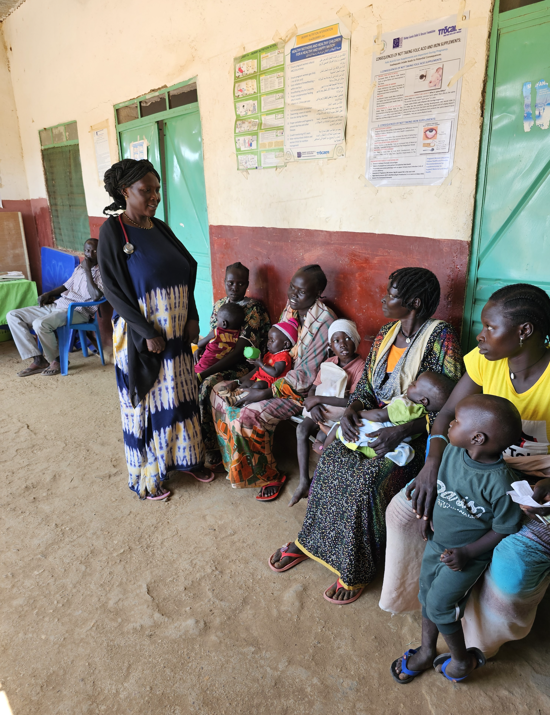 CARE: Mothers and their children wait for treatment at Trócaire’s Amdulu Health Centre in the Nuba Mountains, Sudan 