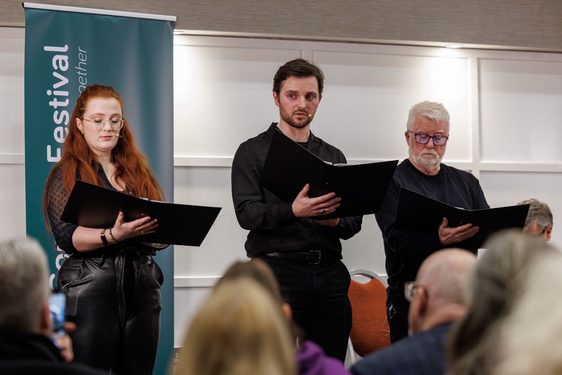 STORYTIME: Eleanor Shannon, Glenn McGivern and Trevor Gill from the Bright Umbrella Theatre troupe in East Belfast read excerpts from the chosen books at the 4 Corners Festival stories\' event