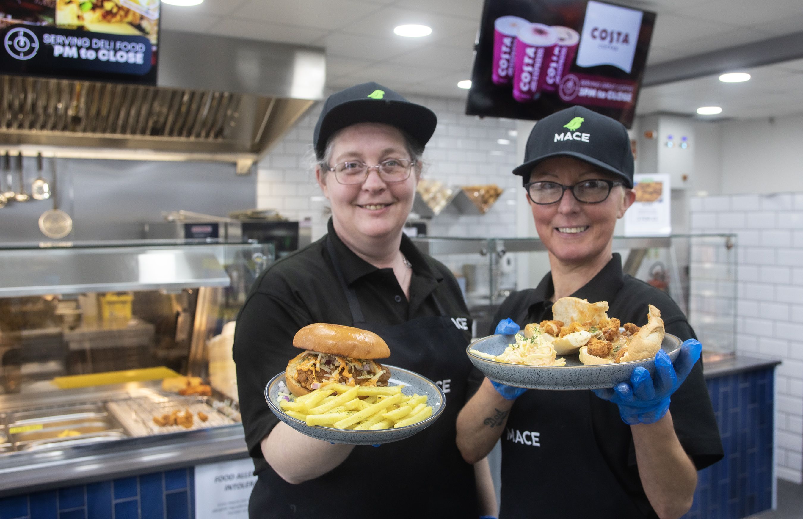 DELI READY: Karen and Sinead from Mount Alverno garage deli display some of the delicious hot food available daily