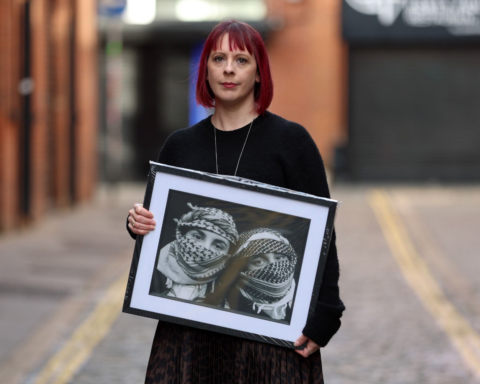 PALESTINE: Carrie Davenport with a photograph for Friday\'s exhibition at the Oh Yeah Centre