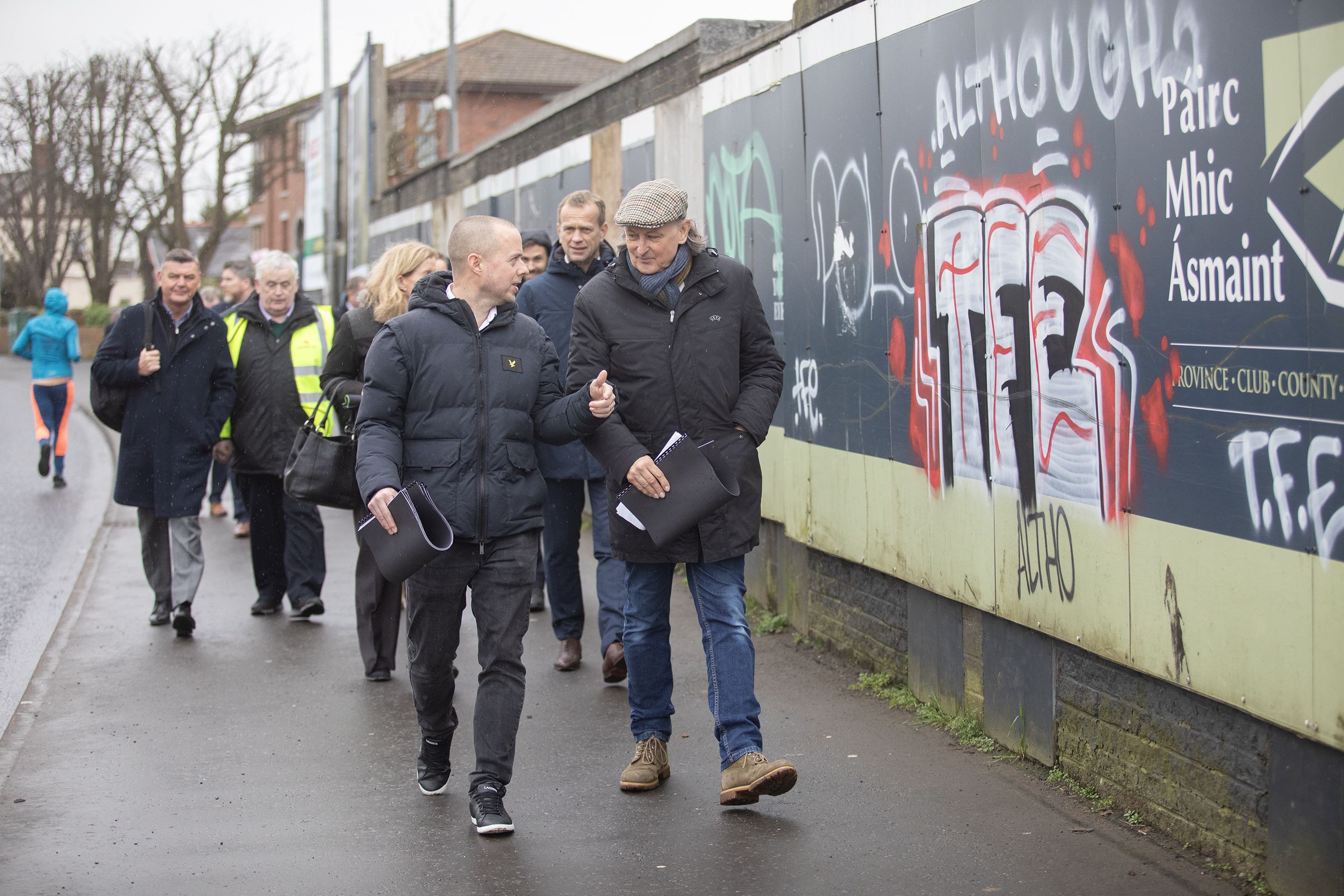 POSITIVE: The delegation walking along the front of the Andersonstown Road after the visit to Casement Park