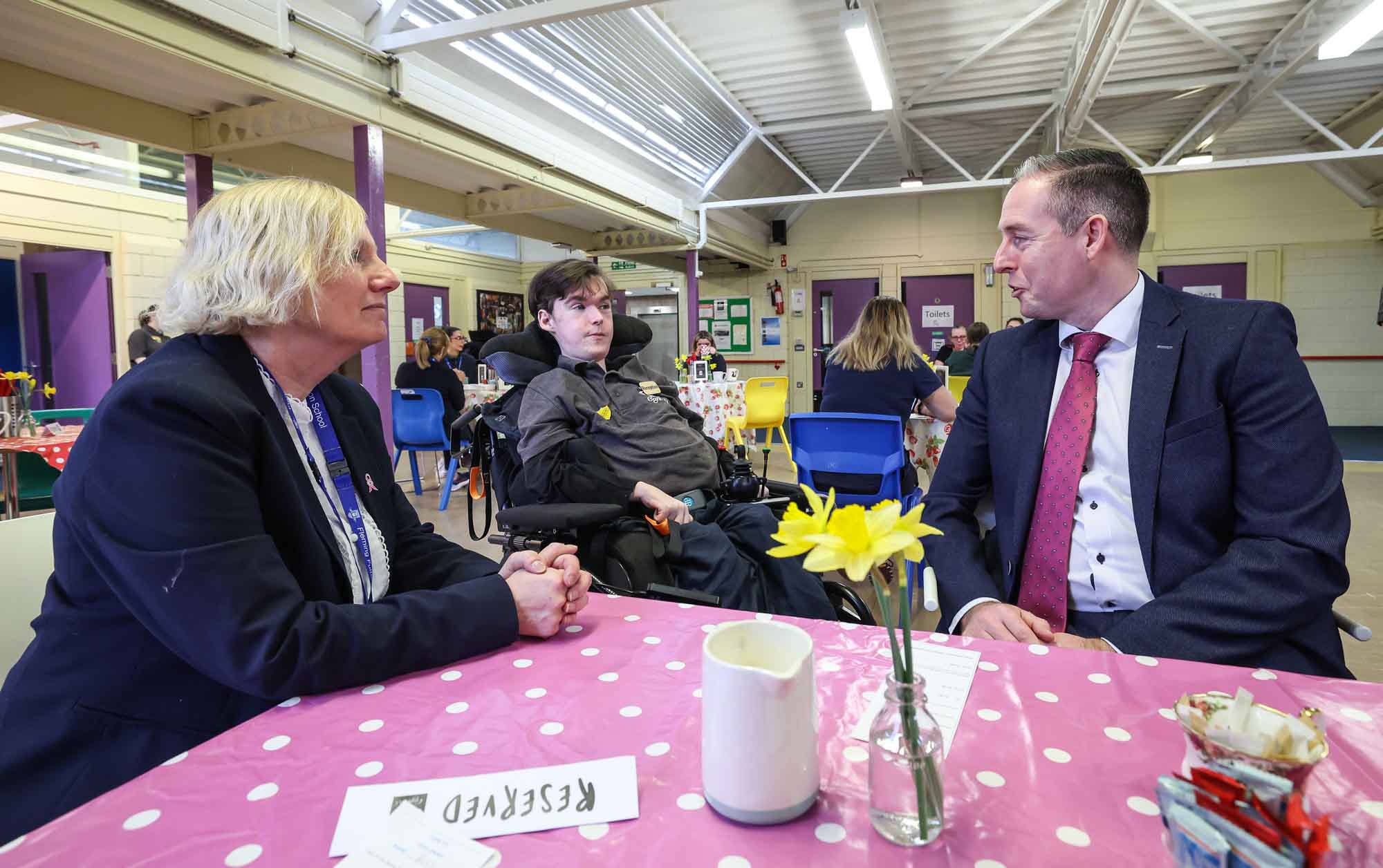 VISIT: Education Minister Paul Givan with Principal Karen Hancock and Fleming Fulton Head Boy Daniel Mitchell