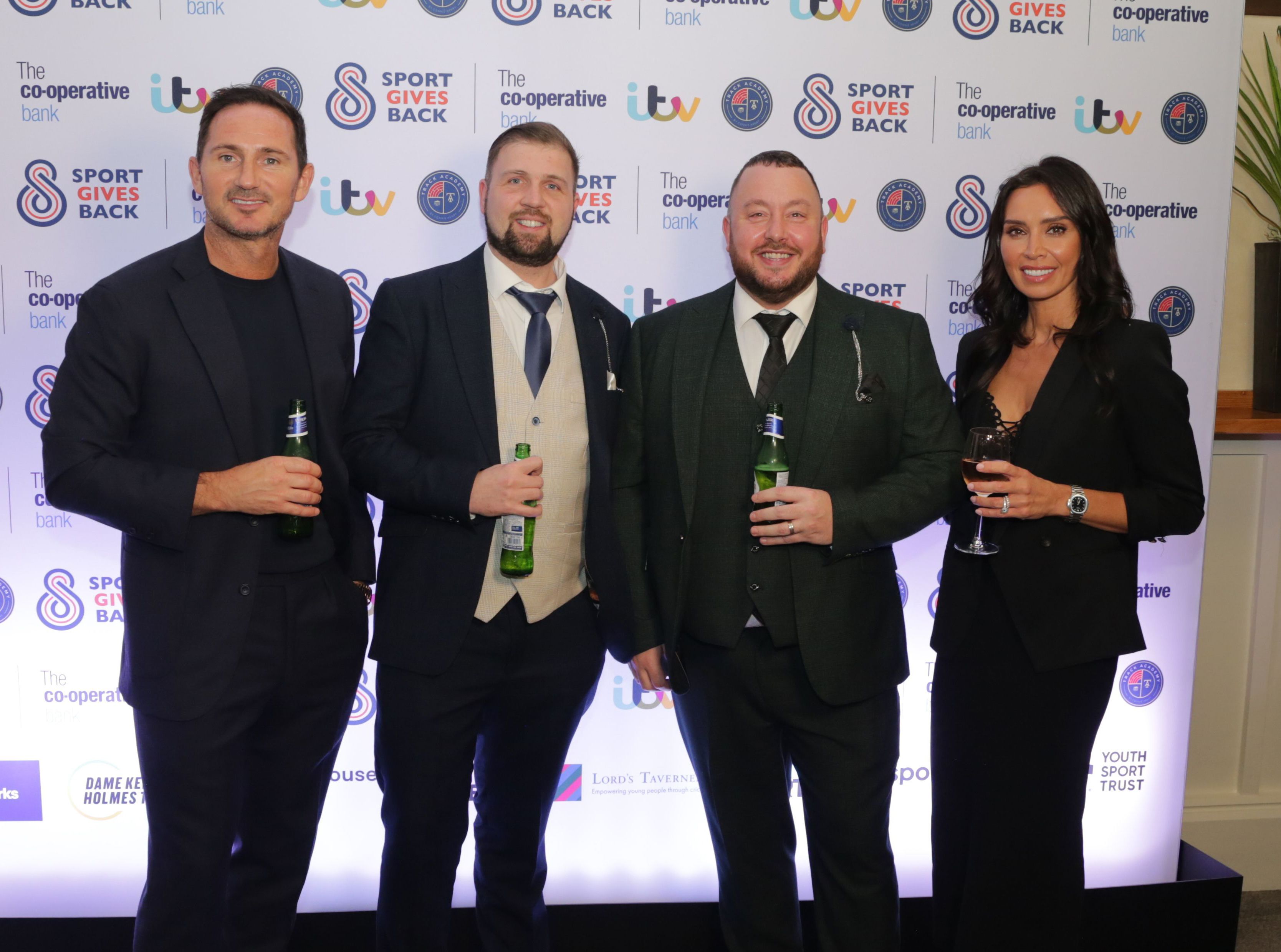CHEERS: Footballer Frank Lampard, Joe Donnelly, CEO of TAMH, Mickey Meehan, Youth Coordinator TAMHI, and TV presenter Christine Lampard
