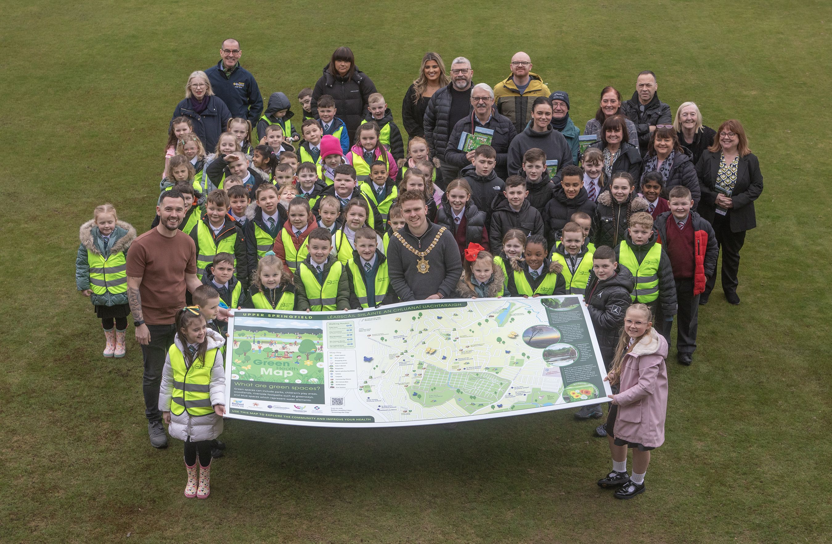 HEALTH: Upper Springfield Development Trust with children from John Paul II PS and Holy Trinity PS unveiling the new green health map