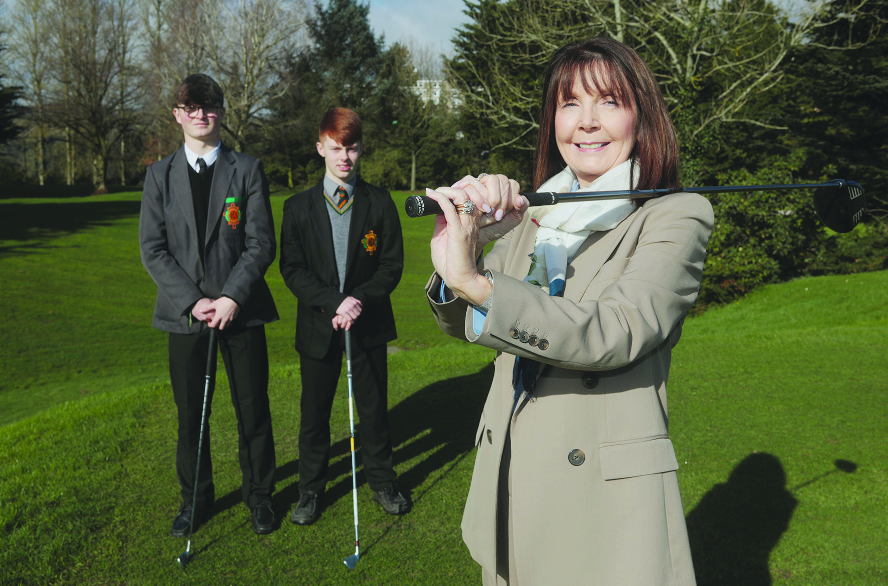 Fionn Dobbin (left) and Year 11 pupil Eoin Burrows with St Mary\'s CBGS Principal Siobhan Kelly at Balmoral Golf Club. Fionn is set to take up a golf scholarship with Kansas State University in September
