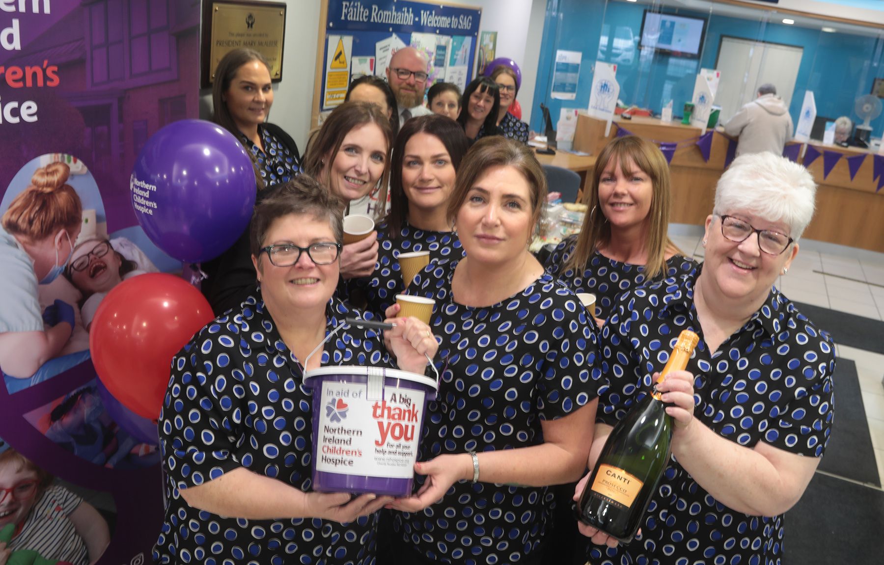 BIG HEARTS: Staff from SAG Credit Union in Andersonstown during their coffee morning on Thursday