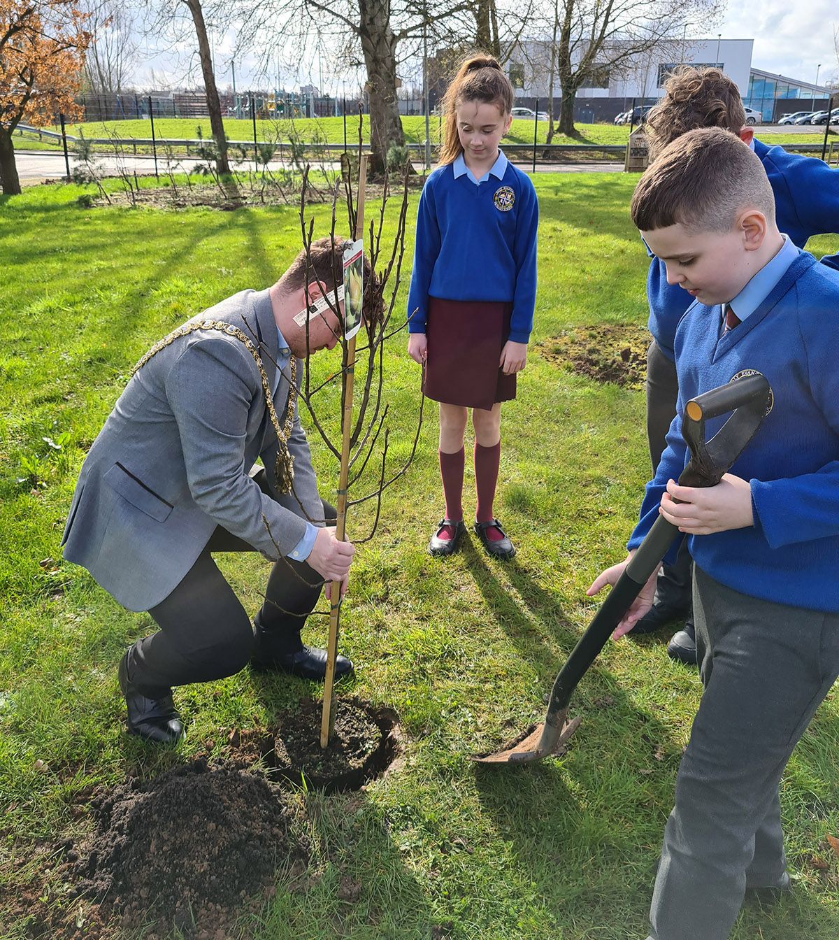 GETTING HIS HANDS DIRTY: Lord Mayor Ryan Murphy helps out at the school