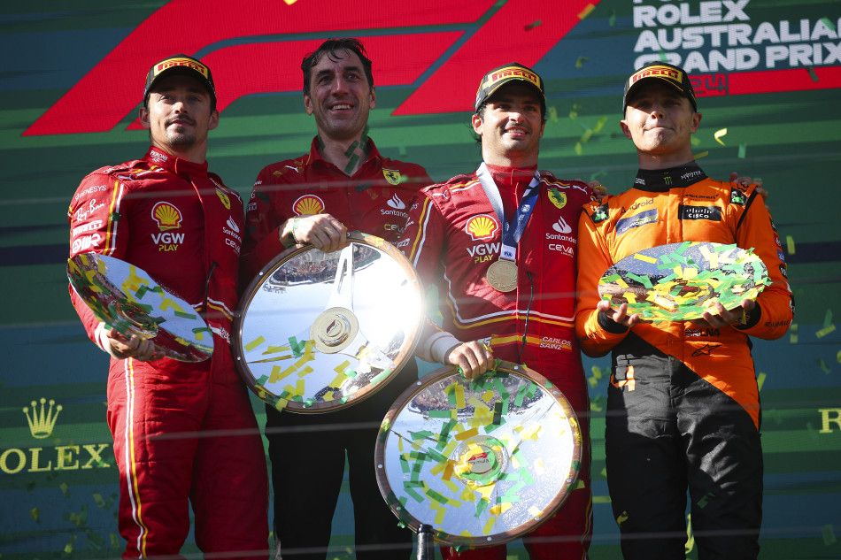 PODIUM: Max Verstappen’s car woes allowed Carlos Sainz (third left) to take an unexpected win in Australia