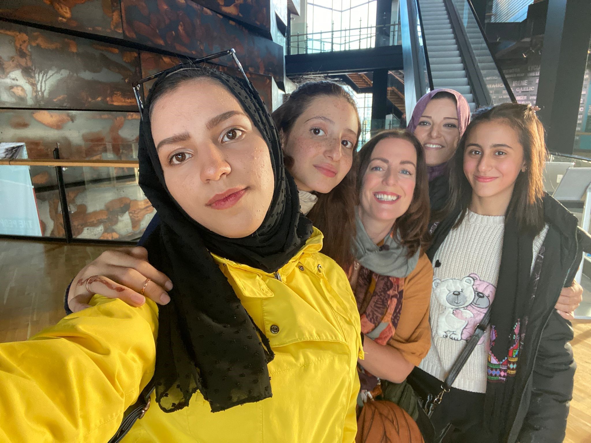 CLOSE BOND: Máiréad Robb, centre, with children Rahaf, Yara and Malak and their teacher Rinan during a trip to Titanic Belfast in September 2022