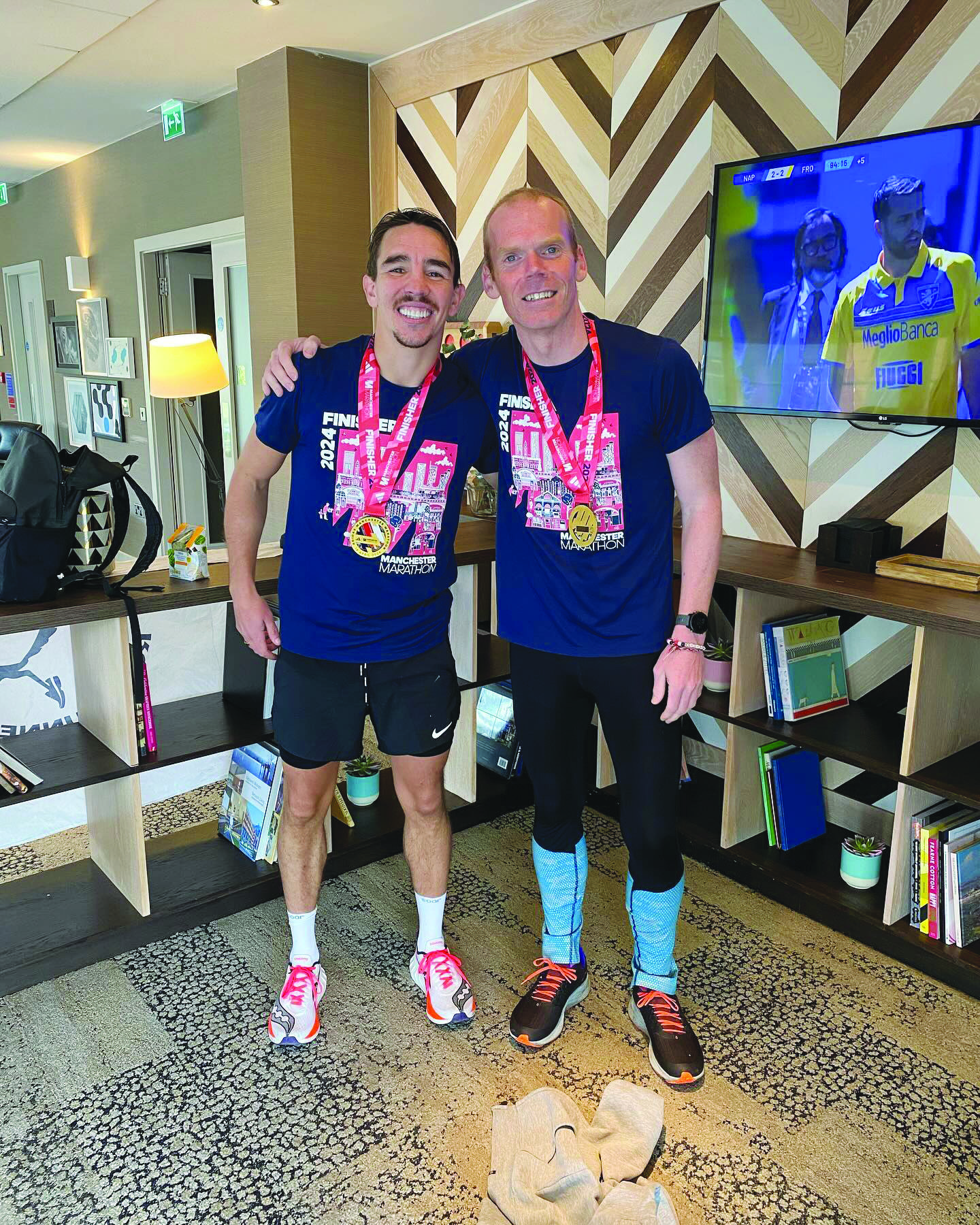 Michael Conlan with his running coach, Noel McNally after Sunday’s Manchester Marathon