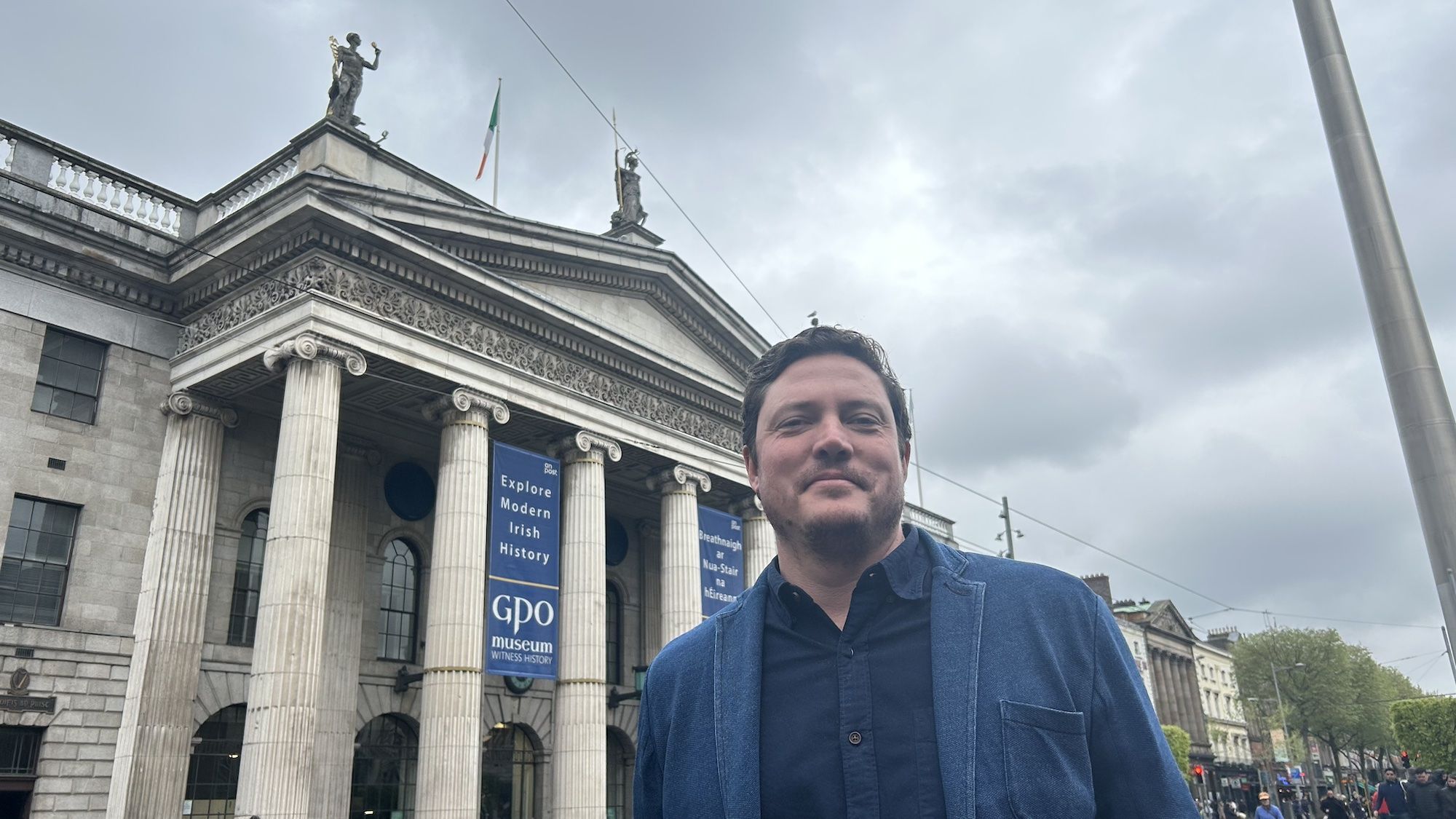 SITE OF STRUGGLE: Boston architect Michael Murphy outside the GPO on O\'Connell Street, Dublin, today - the 108th anniversary of the day the Rising started in Dublin