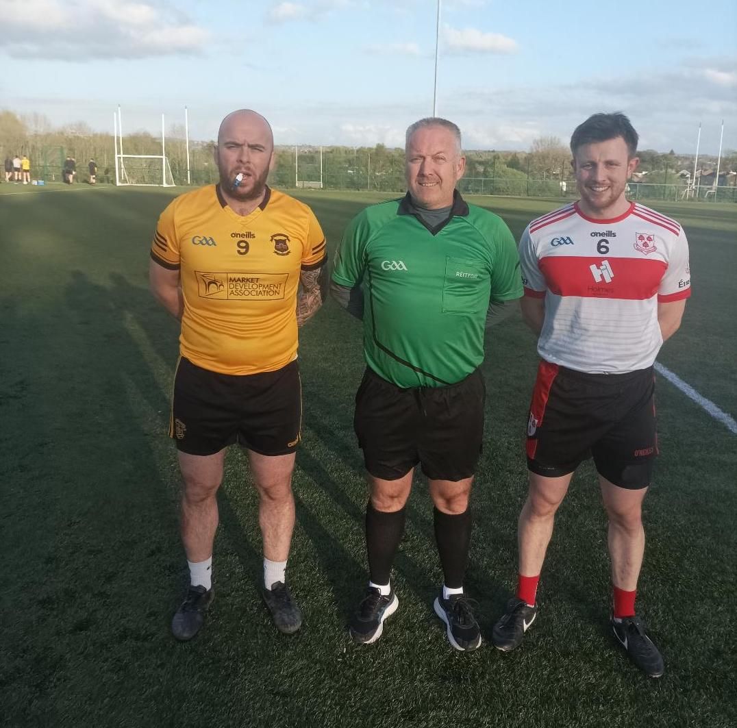 Team captains Ciaran Vernon and Conor McKenna with referee Charlie Hemsworth before the game