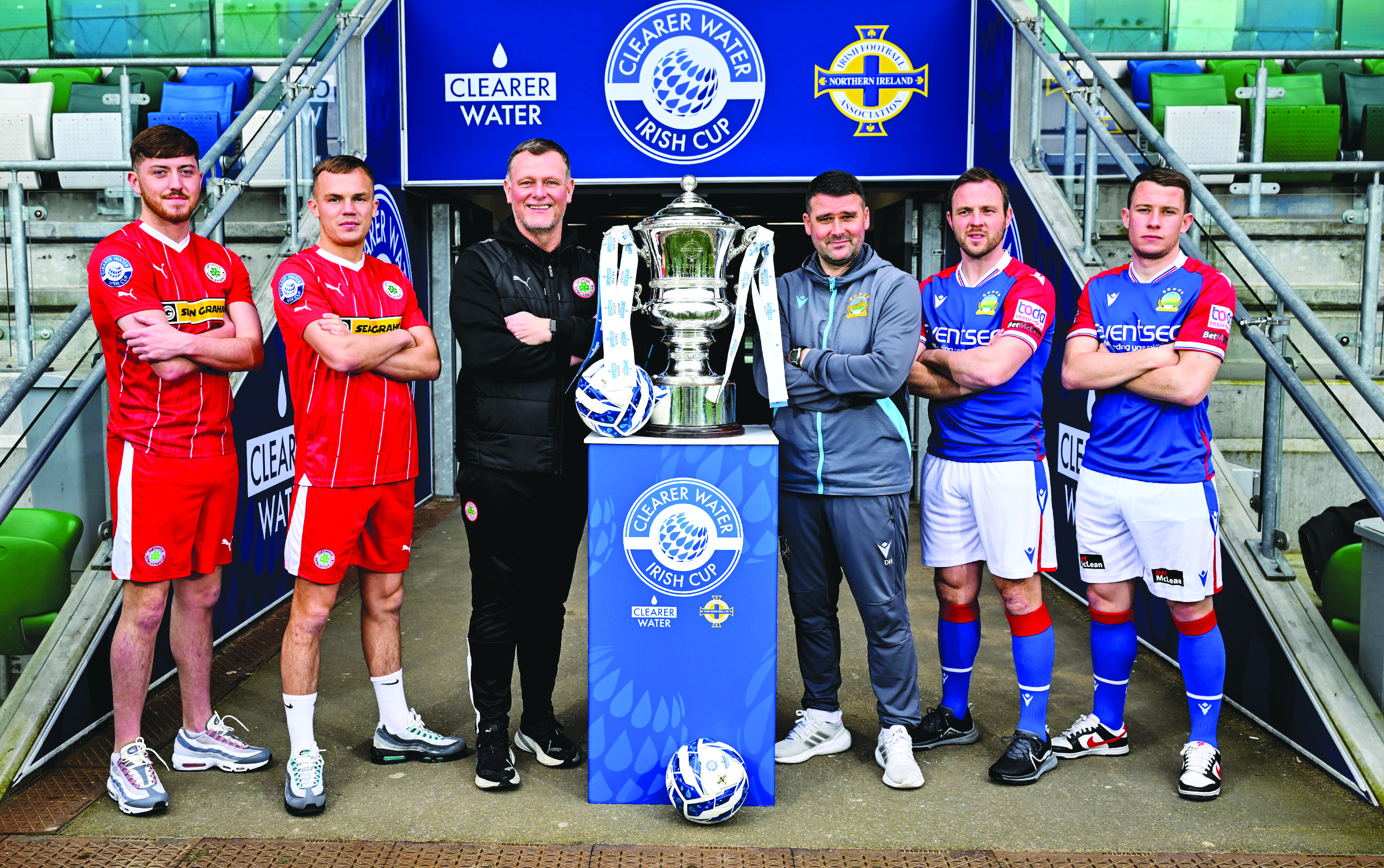 L-R: Cliftonville players Sean Stewart and Rory Hale with manager Jim Magilton stand alongside Linfield boss David Healey and Blues’ duo Jamie Mulgrew and Kyle McLean at Windsor Park last week as the sides get ready to contest Saturday’s sold-out final