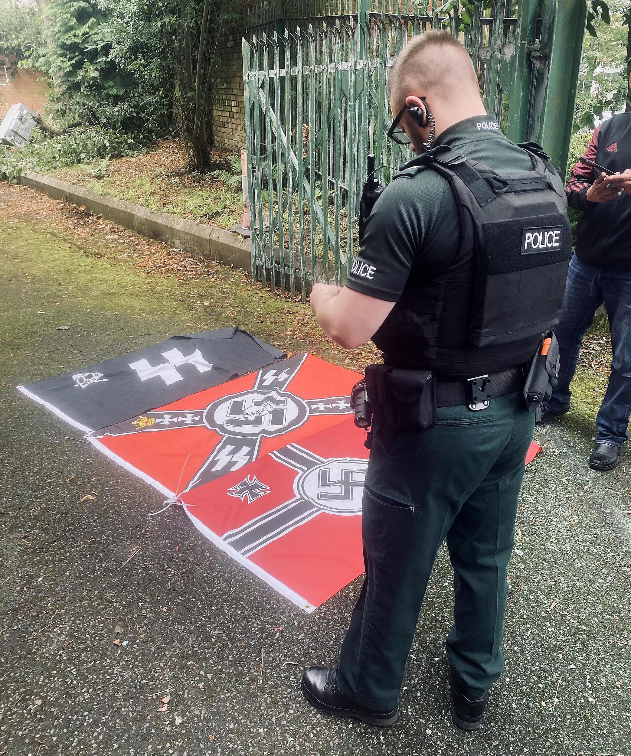 HATE CRIME: Police examine four Nazi flags put up outside a Dunmurry mosque last August – but why don\'t republican racists join their loyalist brethren?