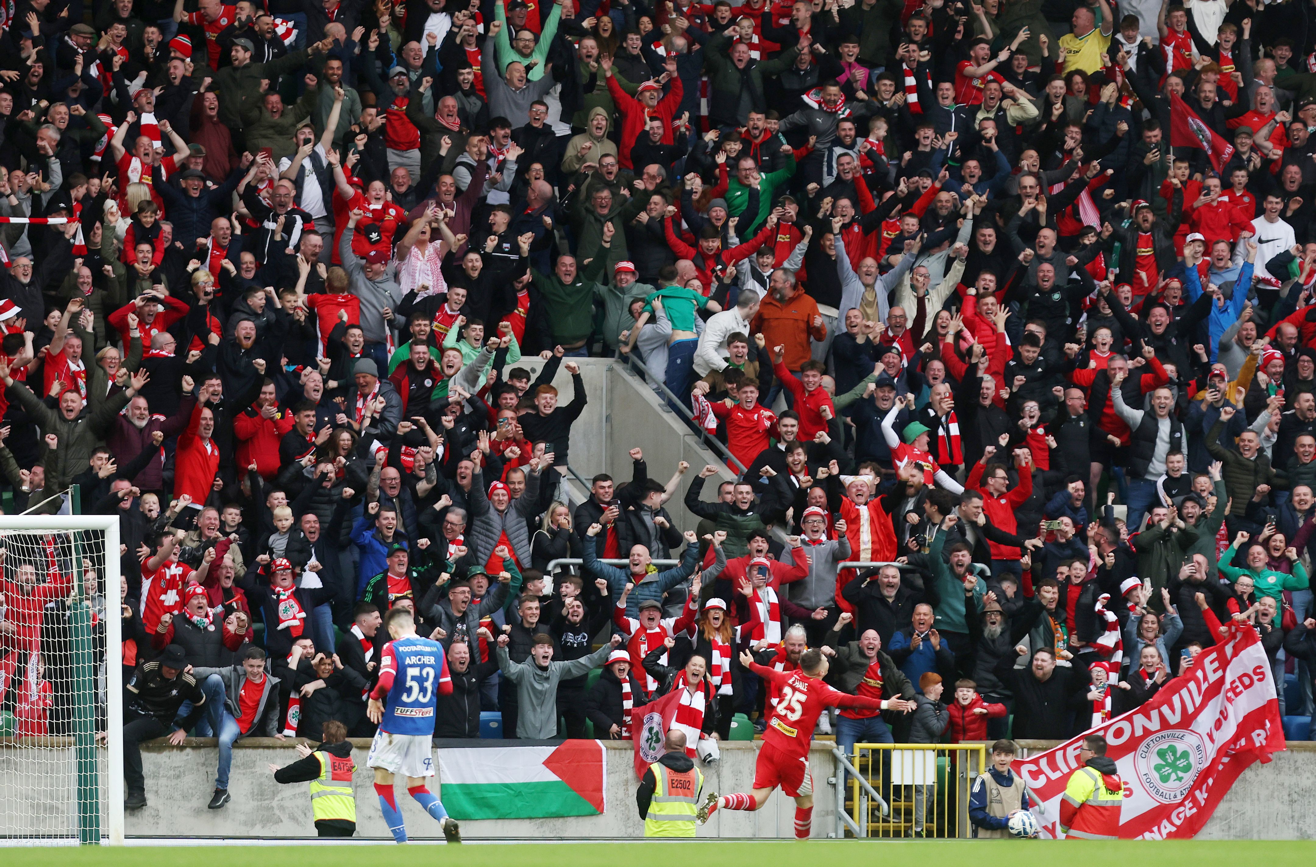 Ronan Hale wheels away with his arms aloft as he sealed Cliftonville\'s Irish Cup final win 