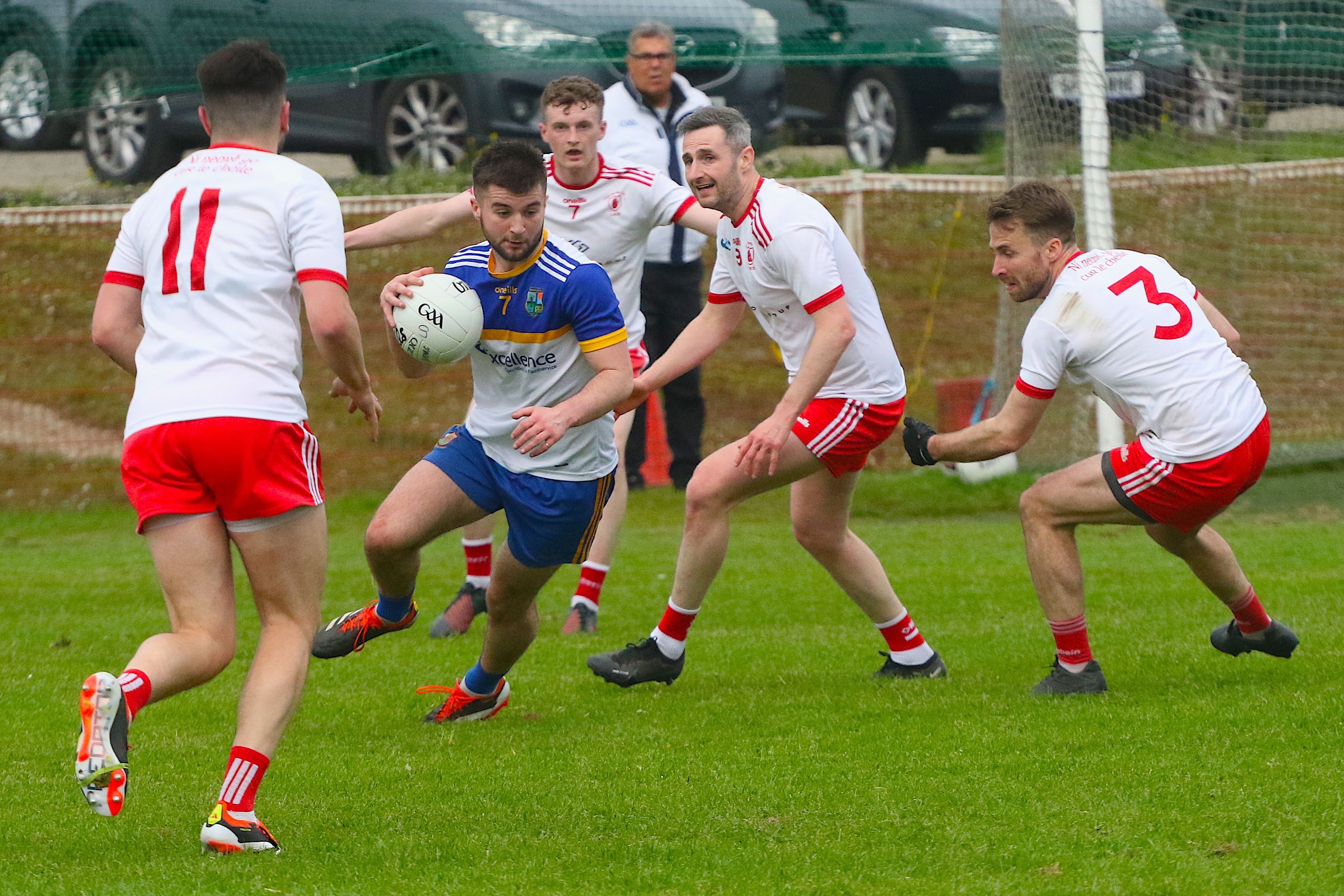 Shay Campbell tries to move away from Lámh Dhearg challenges on Wednesday 