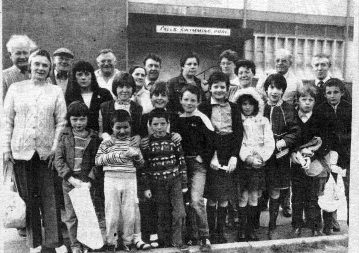BIG SPLASH: Joe McCann, manager of Falls Road Swimming Baths, with Happy Smith’s Swimming Group outisde the pool before it was closed for 18 months for renovations