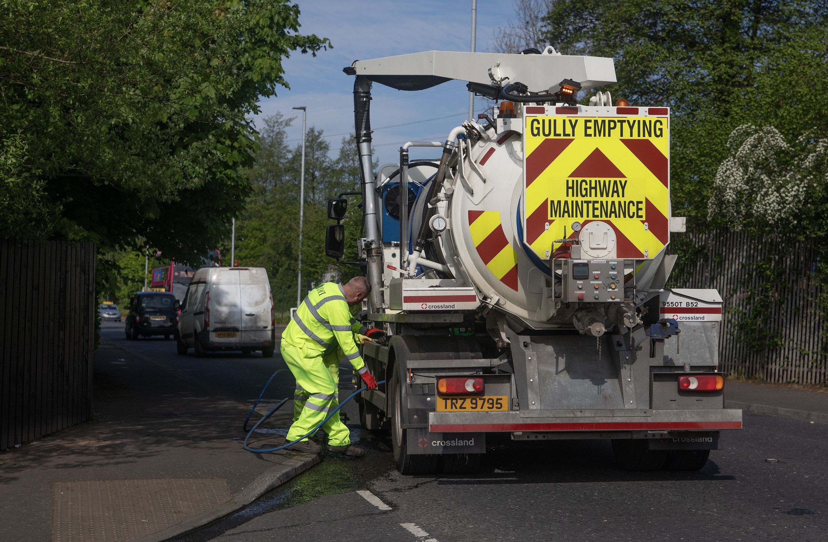 FLOODING ISSUES: Drain cleaning on Friday morning on the Glen Road close to the bus terminus
