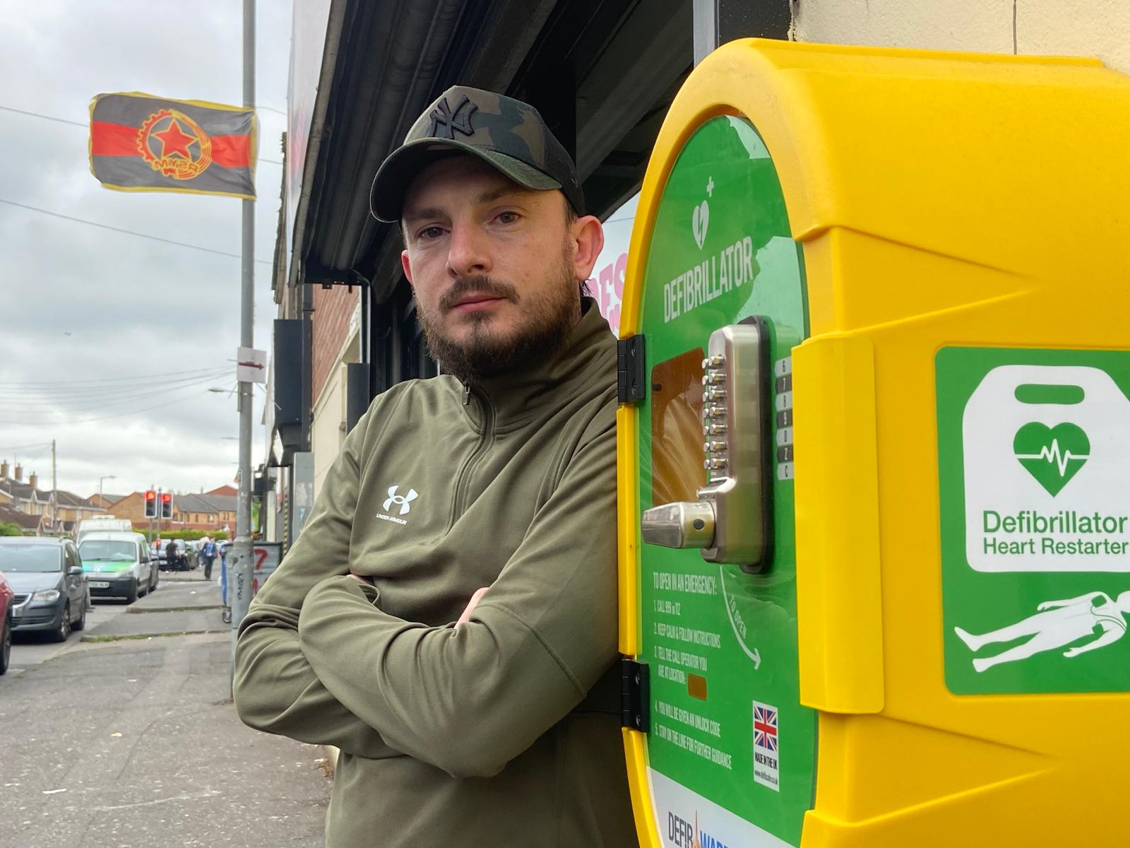 VITAL EQUIPMENT: Sean Doherty from Beechmount Residents\' Collective at one of the new defibrillators