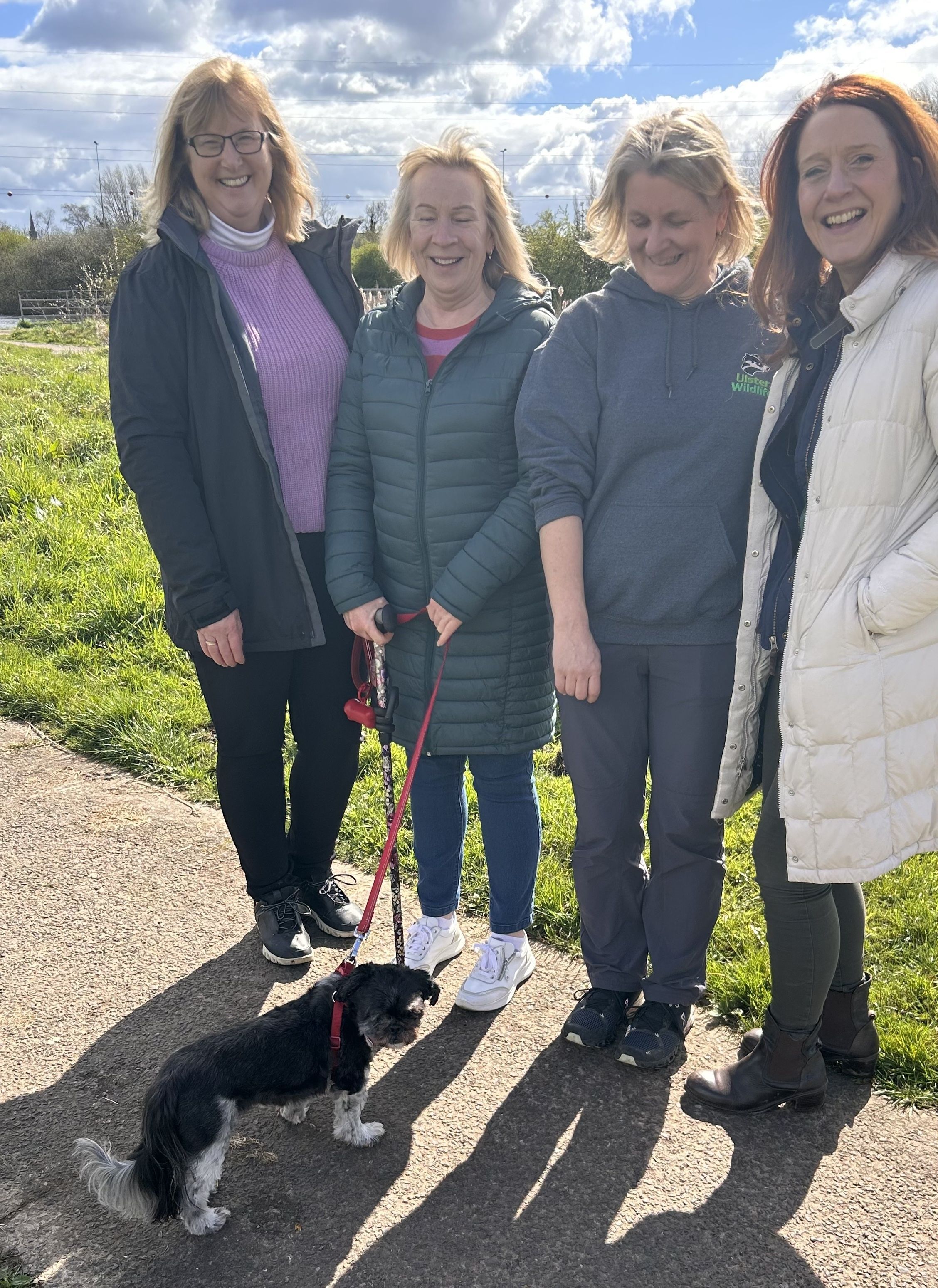 WILDLIFE GUARDIAN: Jennifer Fulton (left) pictured at the Bog Meadow last year with fellow-UWF worker Dawn Patterson and Heather McLachlan of  the National Trust with local dog-walker Paula