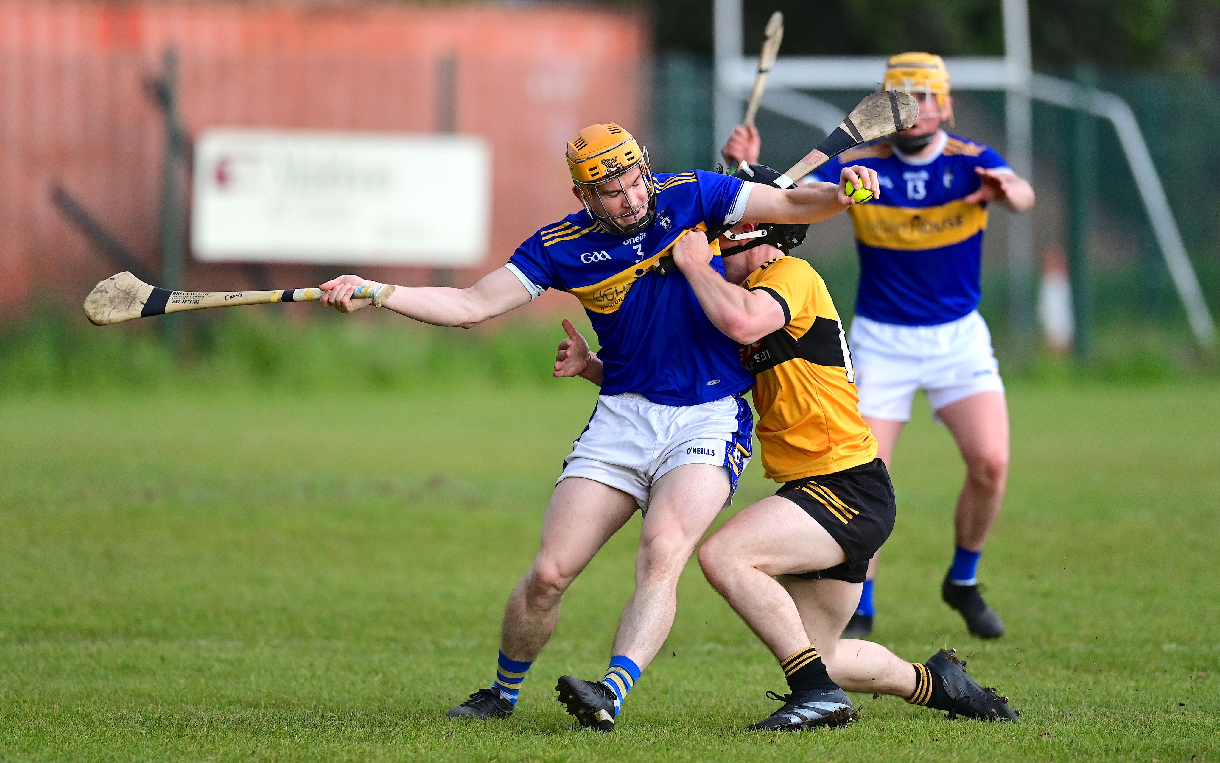 Rossa\'s Chris McGuinness is challenged during Wednesday\'s win over Naomh Éanna 