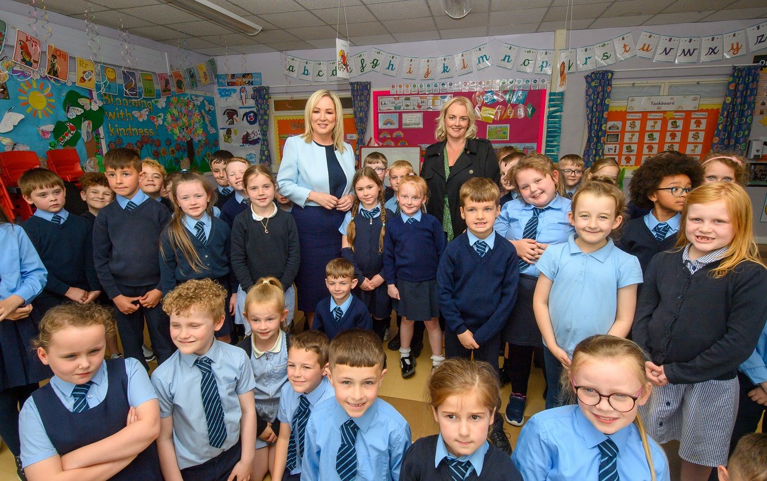 CRESCENDO: First Minister Michelle O’Neill and Junior Minister Pam Cameron with pupils from Good Shepherd PS