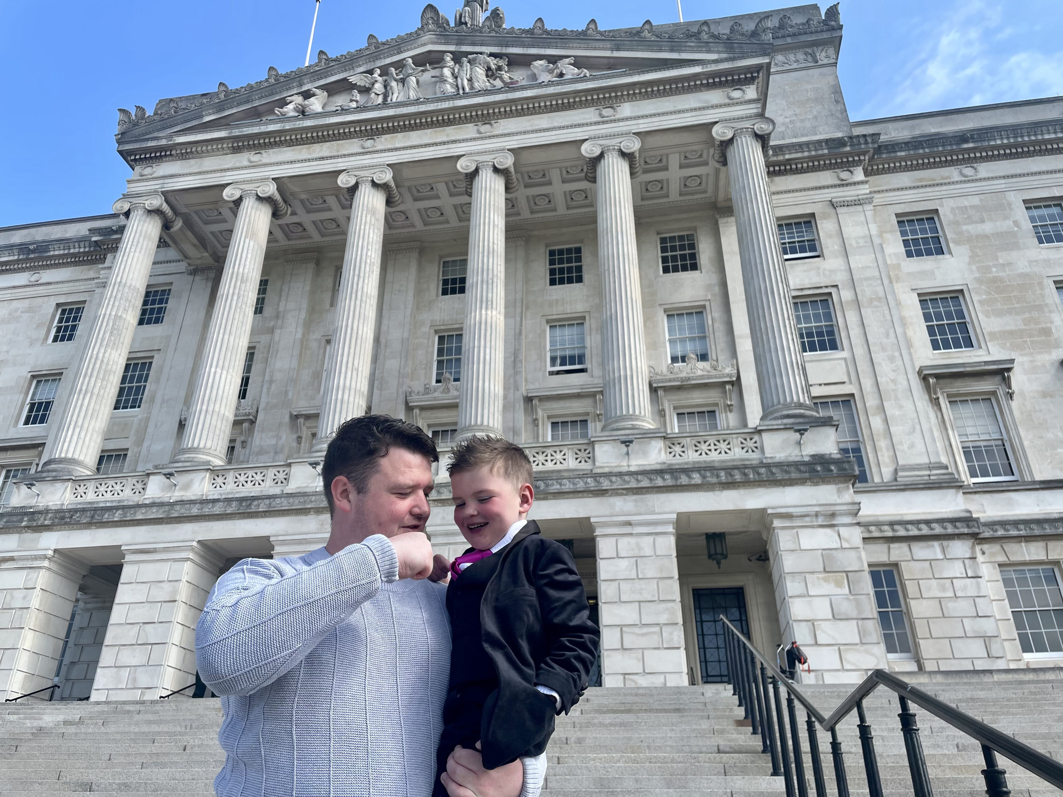 HEROES: Dáithí Mac Gabhann and his dad Máirtín at Stormont on 1 June 2023, when Dáithi’s Law came into effect
