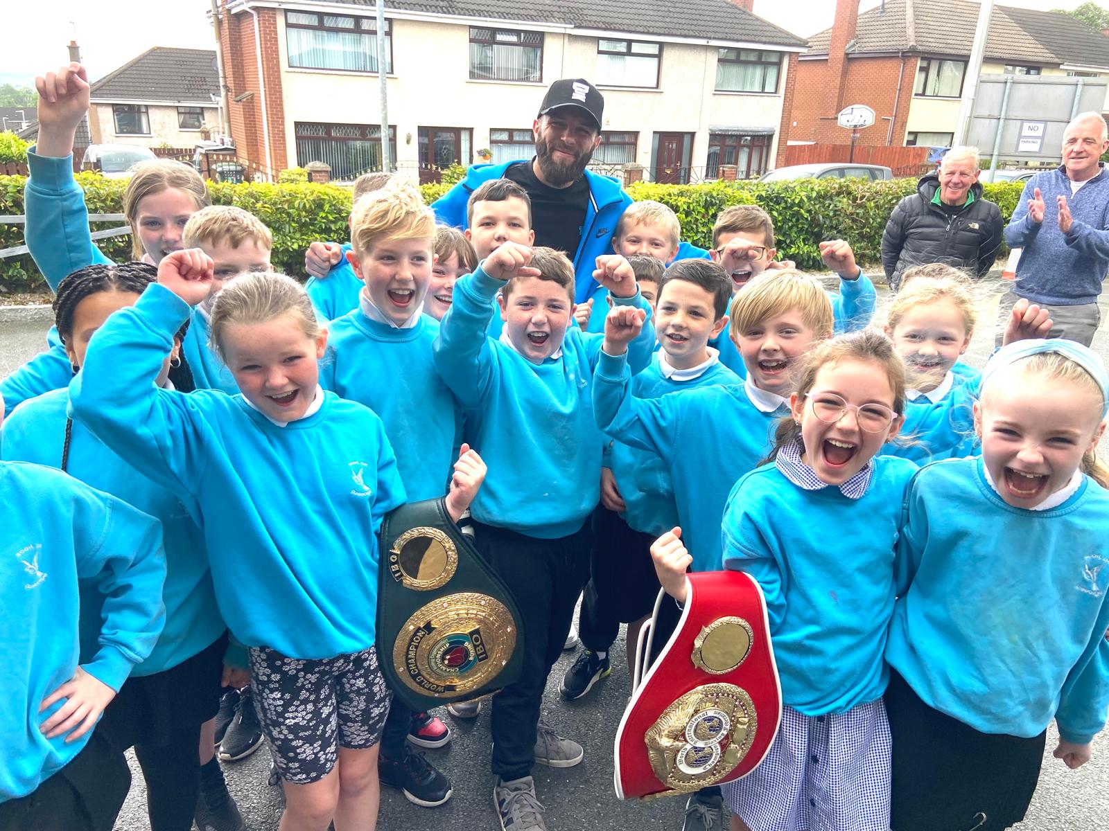 HERO\'S WELCOME: Anthony Cacace with pupils from Scoil na Fuiseoige on Wednesday afternoon