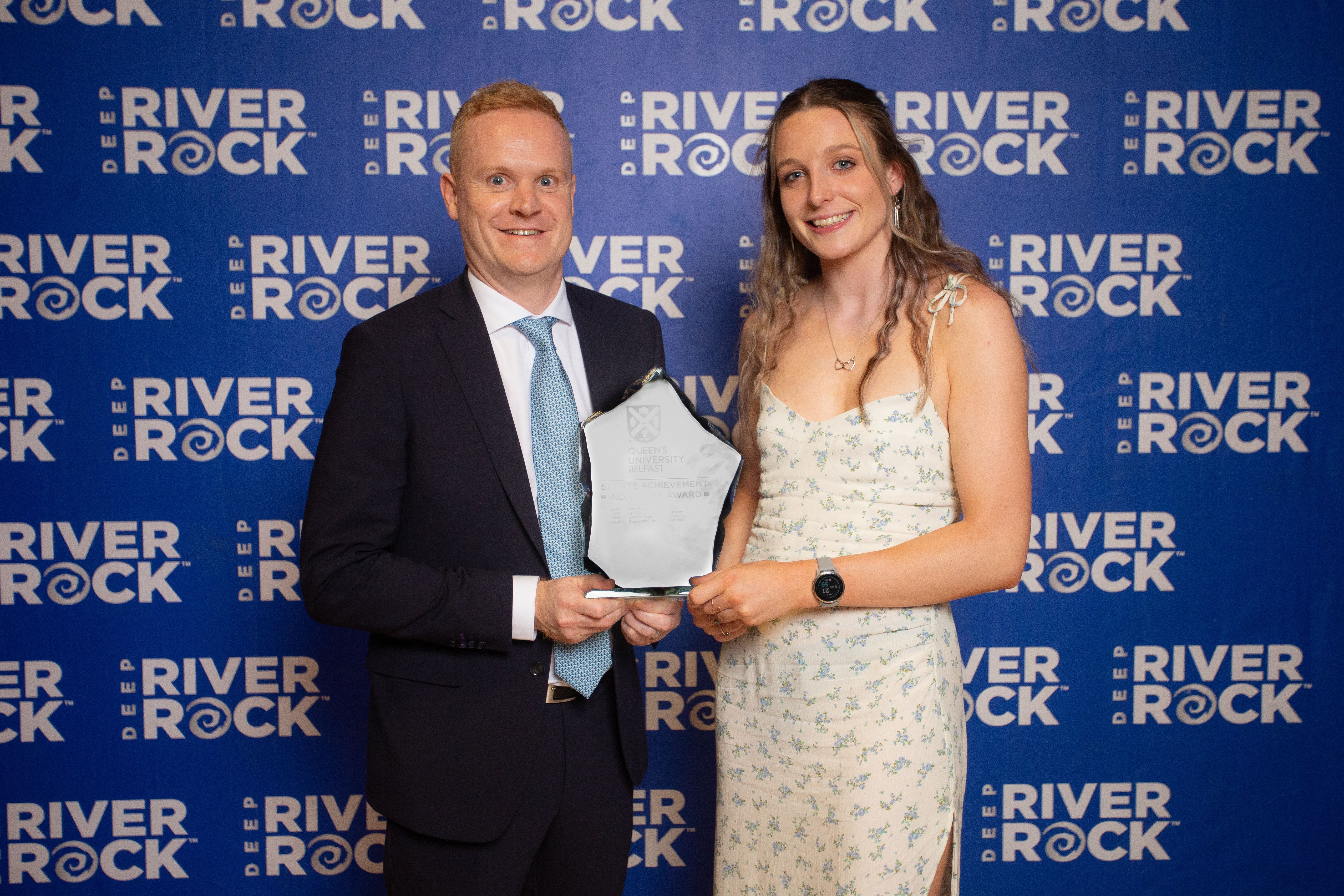 Rachel McCann is pictured receiving her Individual Sporting Achievement Award at the Queen’s University Blues Awards from David Quigley