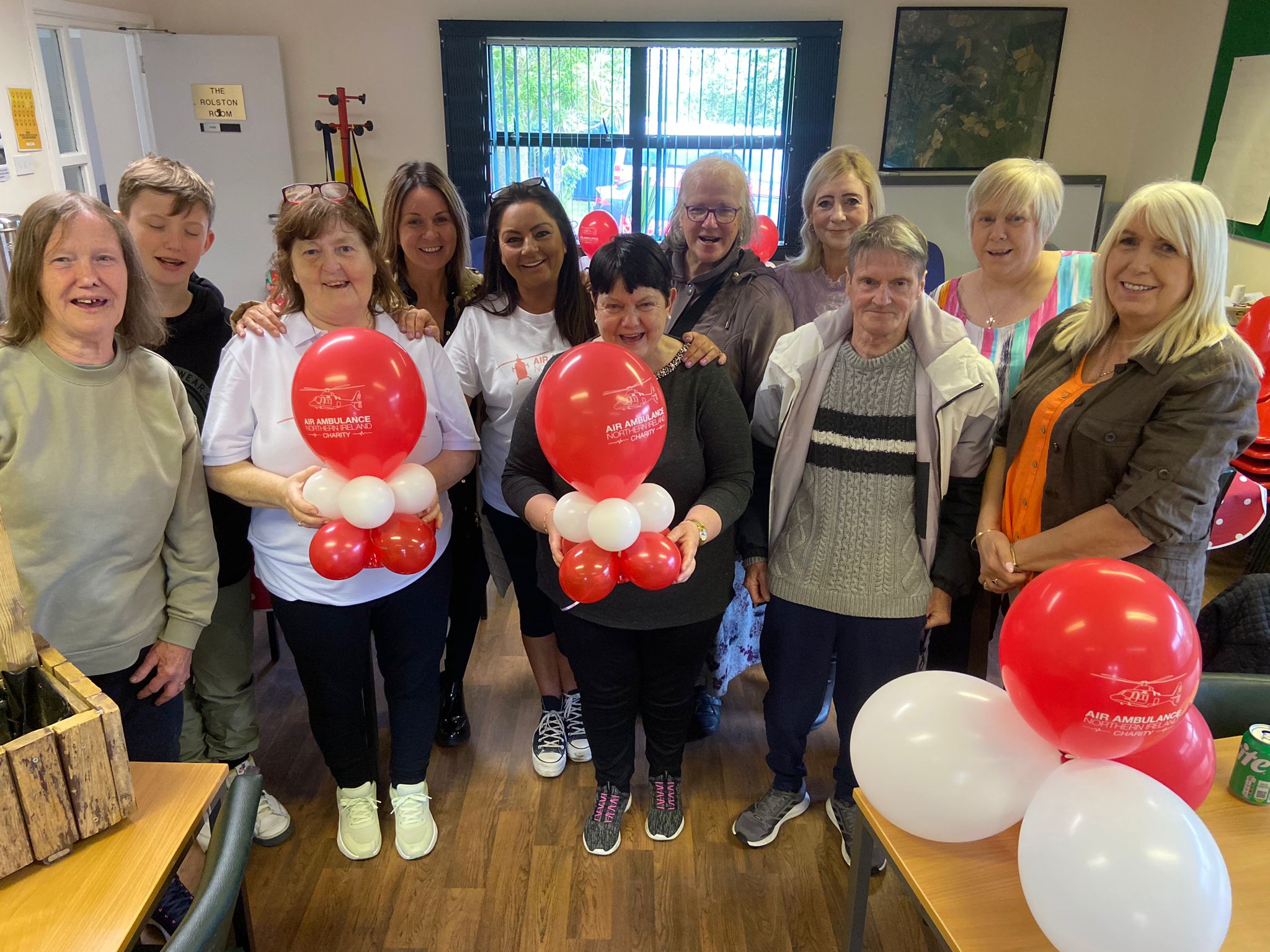 BIG HEARTS: Sharon Stitt and local people at the coffee morning at Wolfhill Centre in Ligoniel